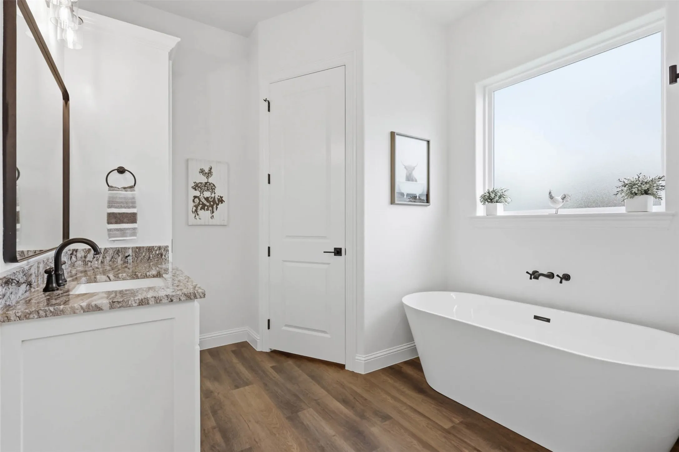 primary bathroom with freestanding tub