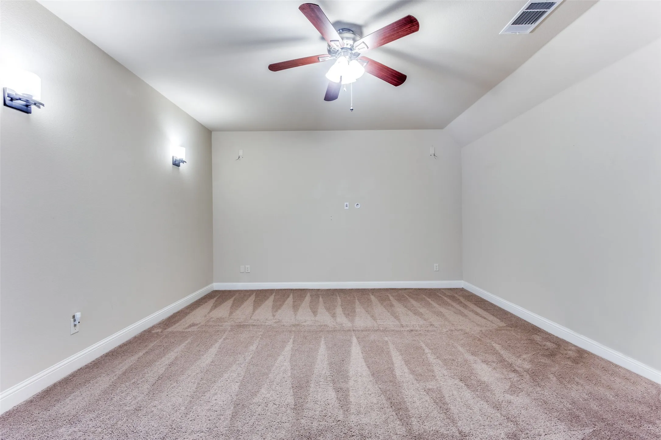 Media room with surround sound and celing fan