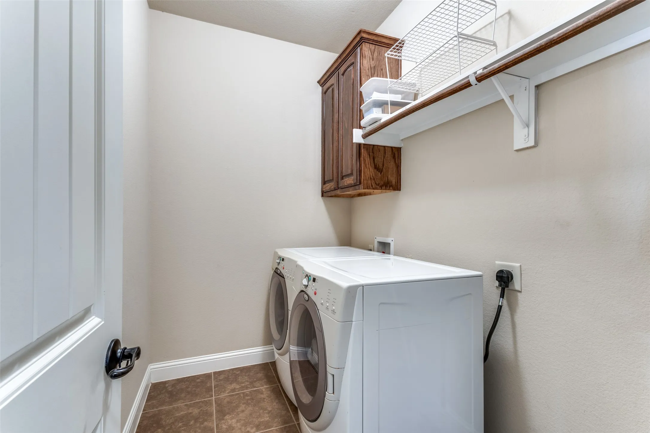 Large laundry room room for additional refrig or workspace