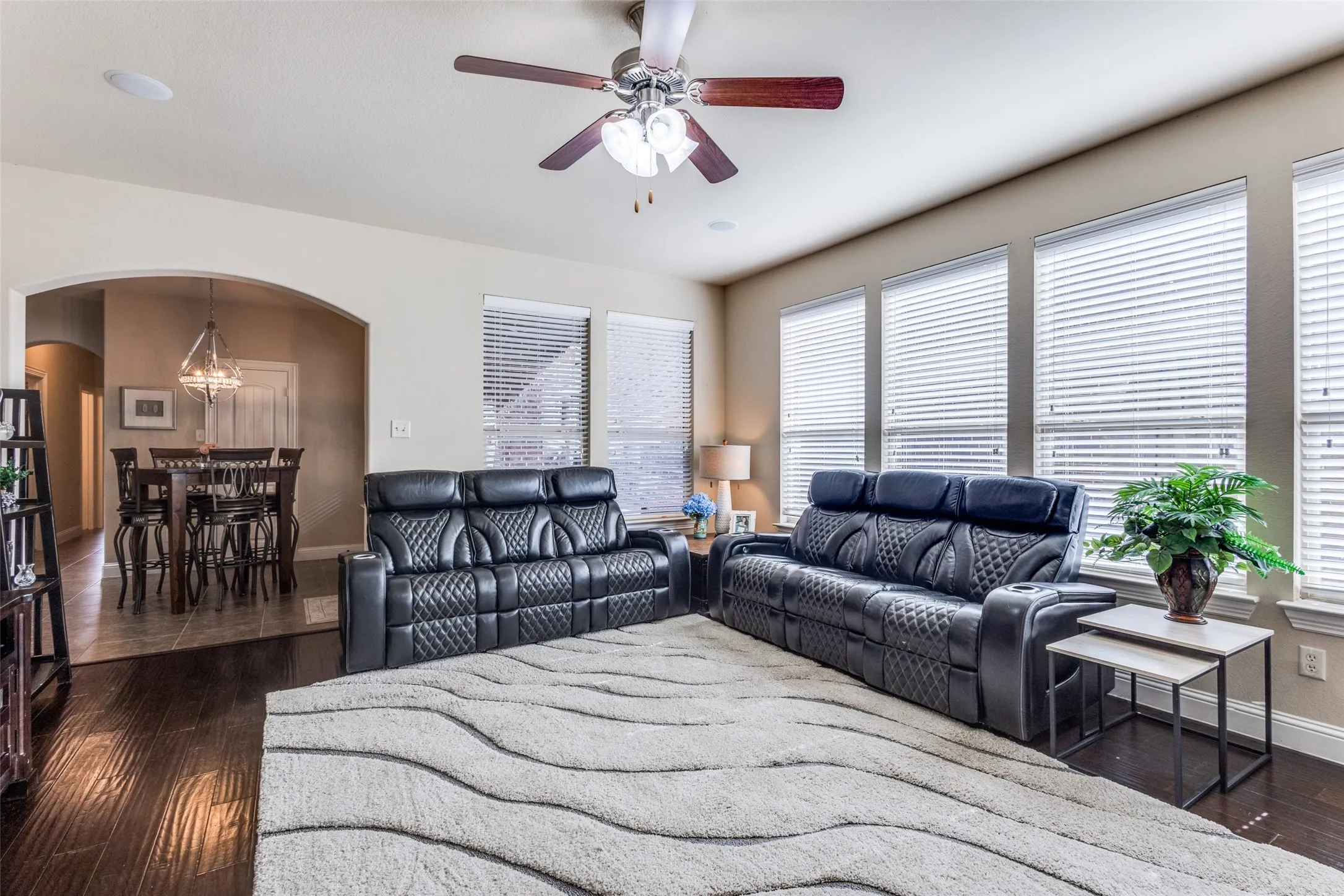 Wall of windows overlooks the side patio and super private