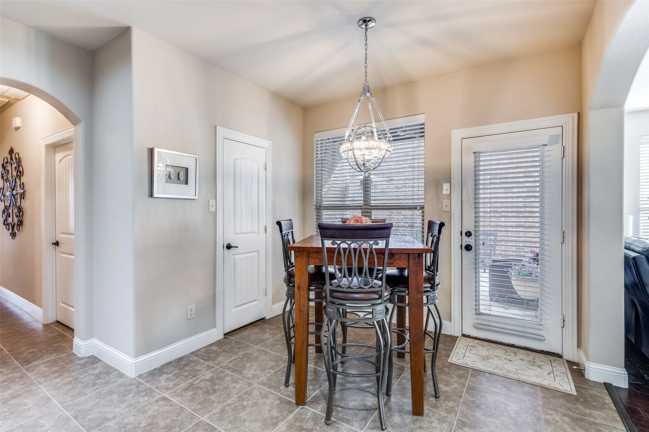 Eating area with pantry and door to side patio