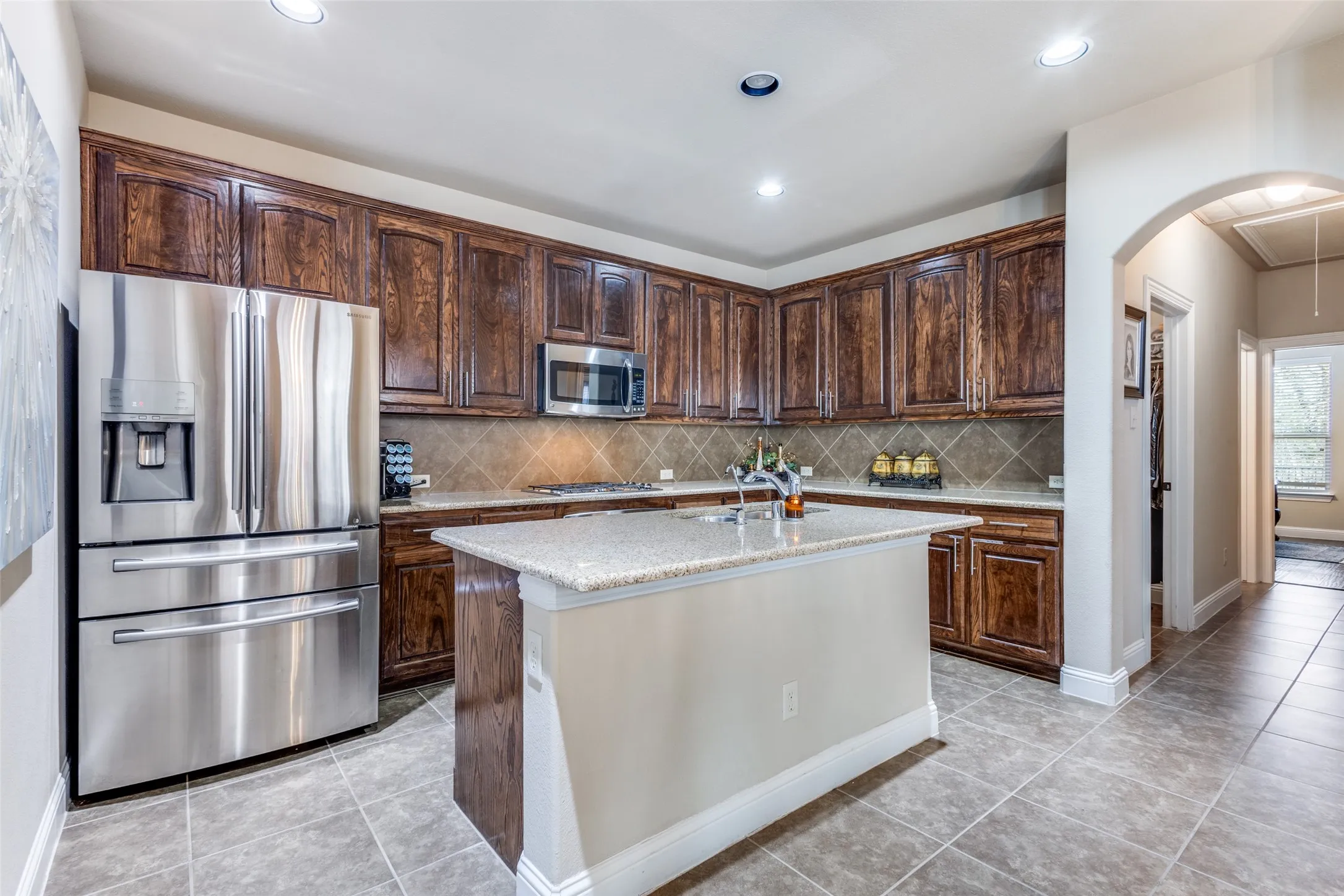 Kitchen with granite counters, island, SS appliances - Refrig stays - TONS of cabinets