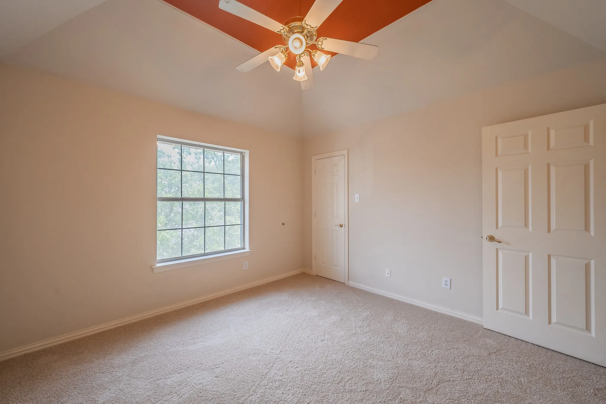 Another secondary bedroom located upstairs with newly installed carpet and fresh wall paint.