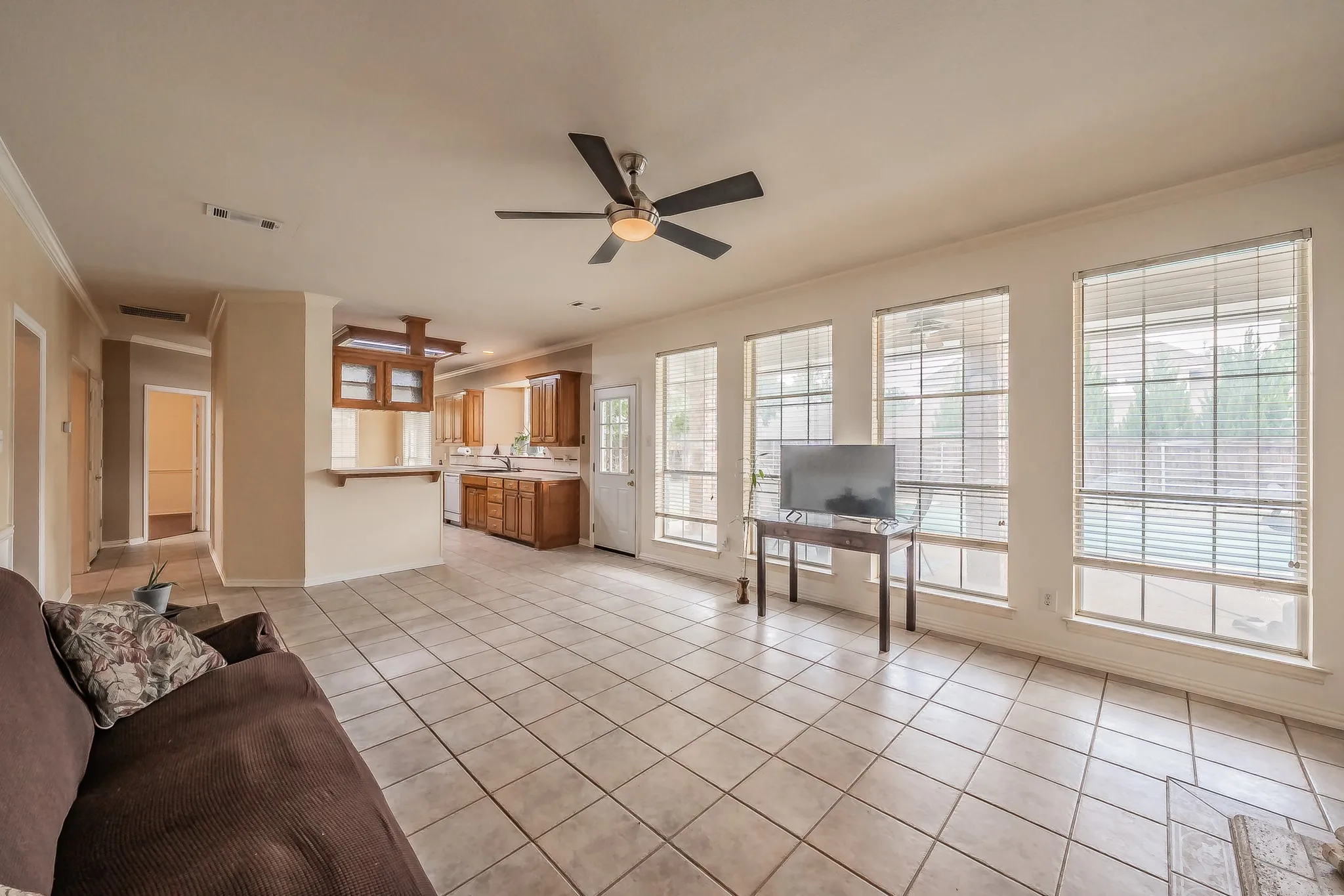 Family room overlooking the backyard, covered patio and pool area.