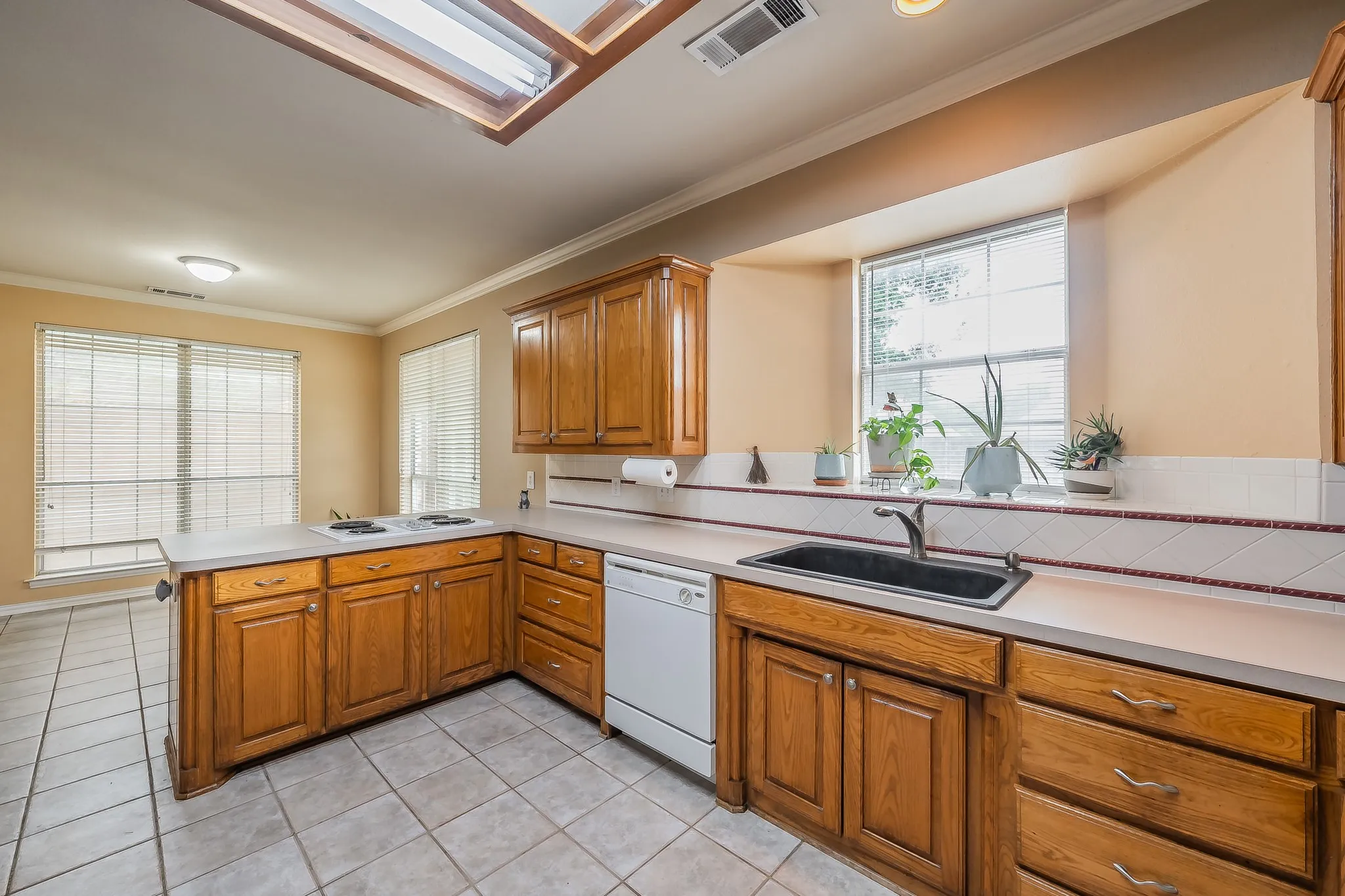 Kitchen overlooks the backyard pool.