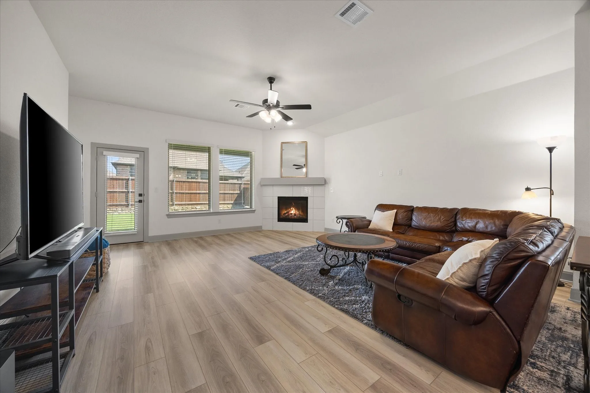 Gorgeous family room includes stunning fireplace