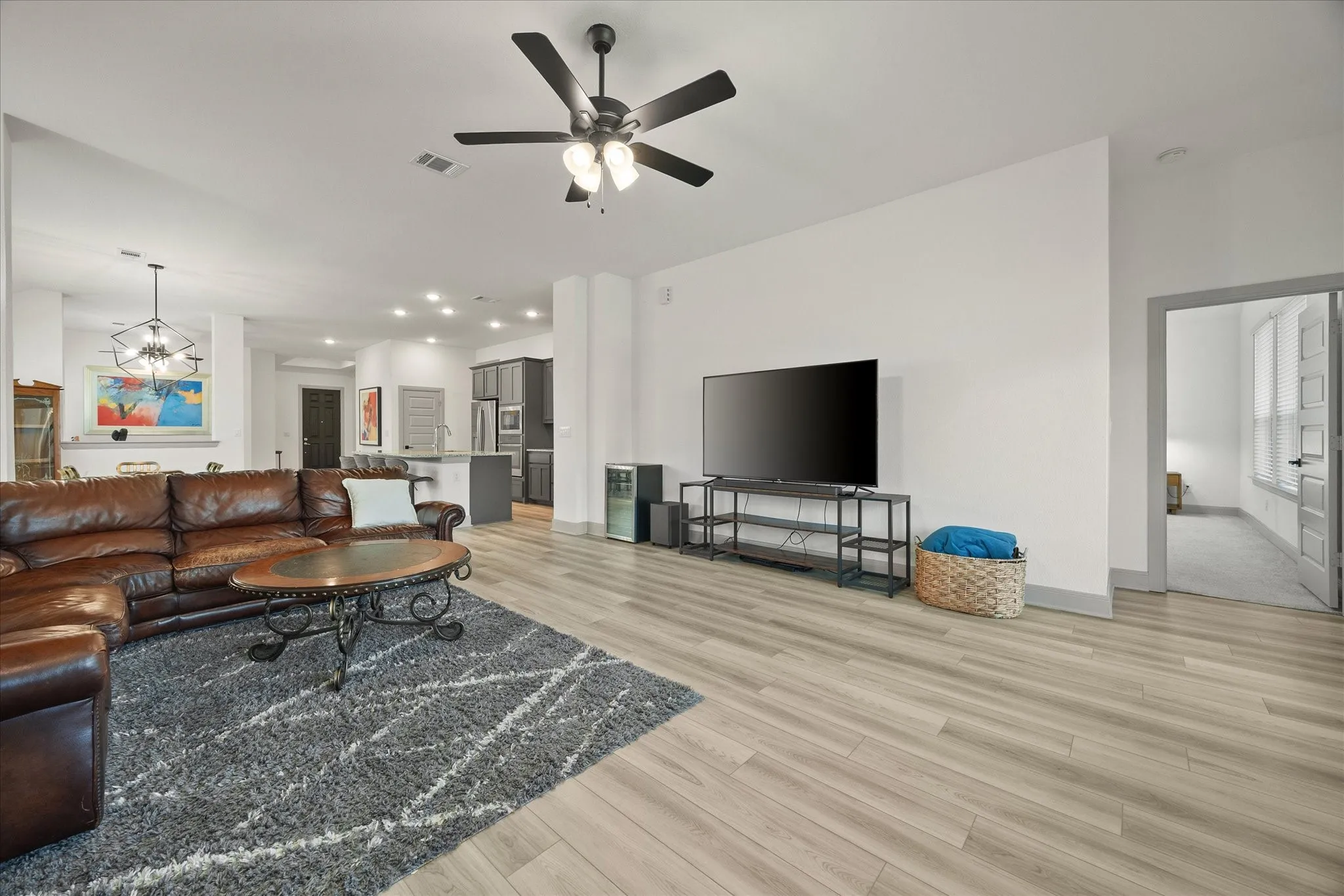 Family room overlooks kitchen and dining area