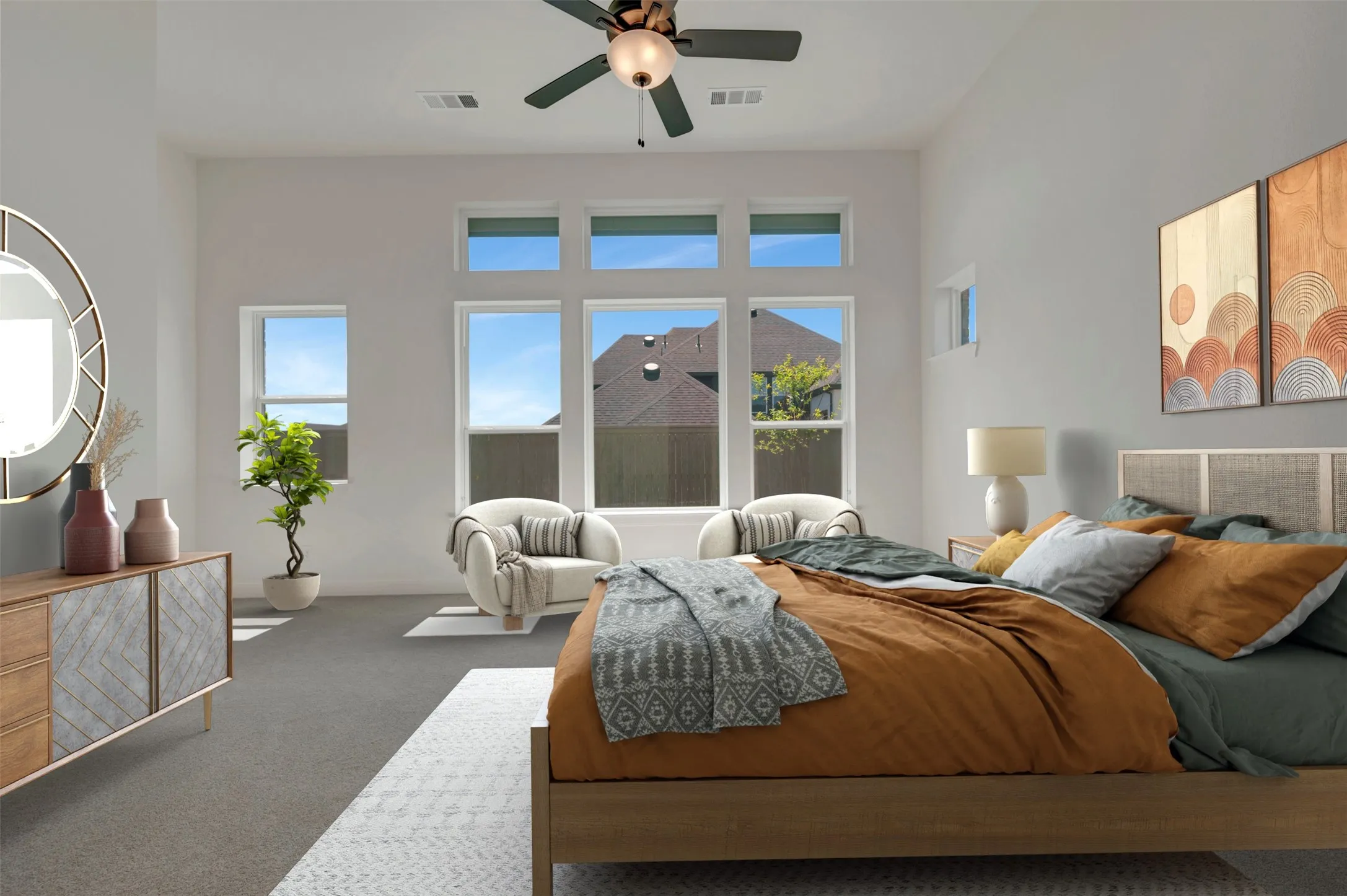 Vaulted ceilings, large windows, ceiling fan, and carpeted flooring
