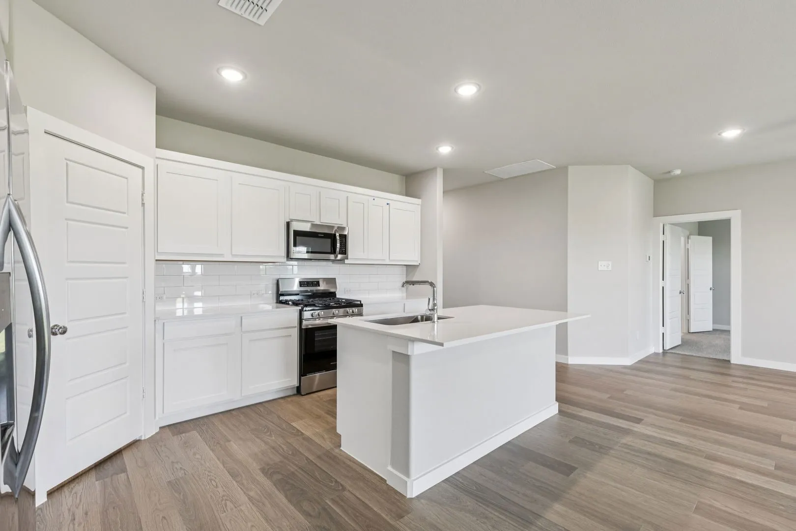 Kitchen in the Harper home plan by Trophy Signature Homes – REPRESENTATIVE PHOTO