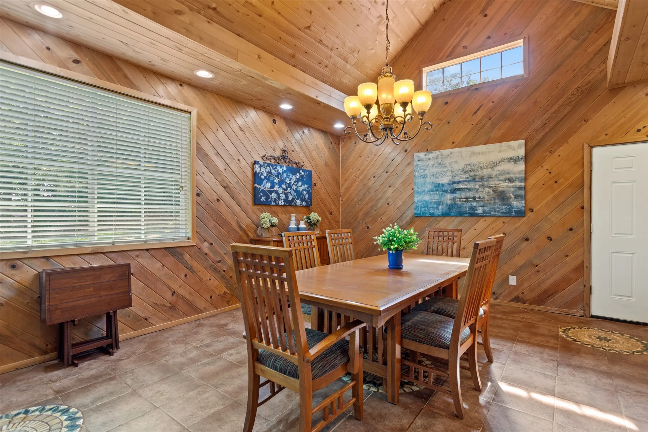 Vaulted ceiling featuring natural wood-finish planking throughout