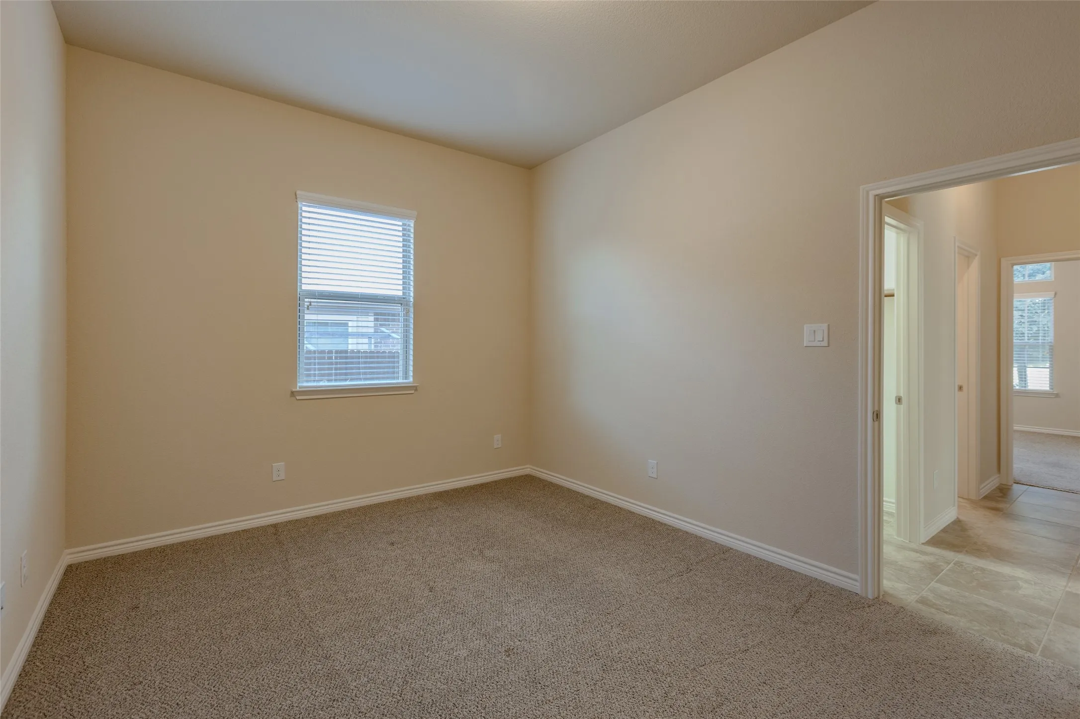 Downstairs bedroom off utility room and full bath