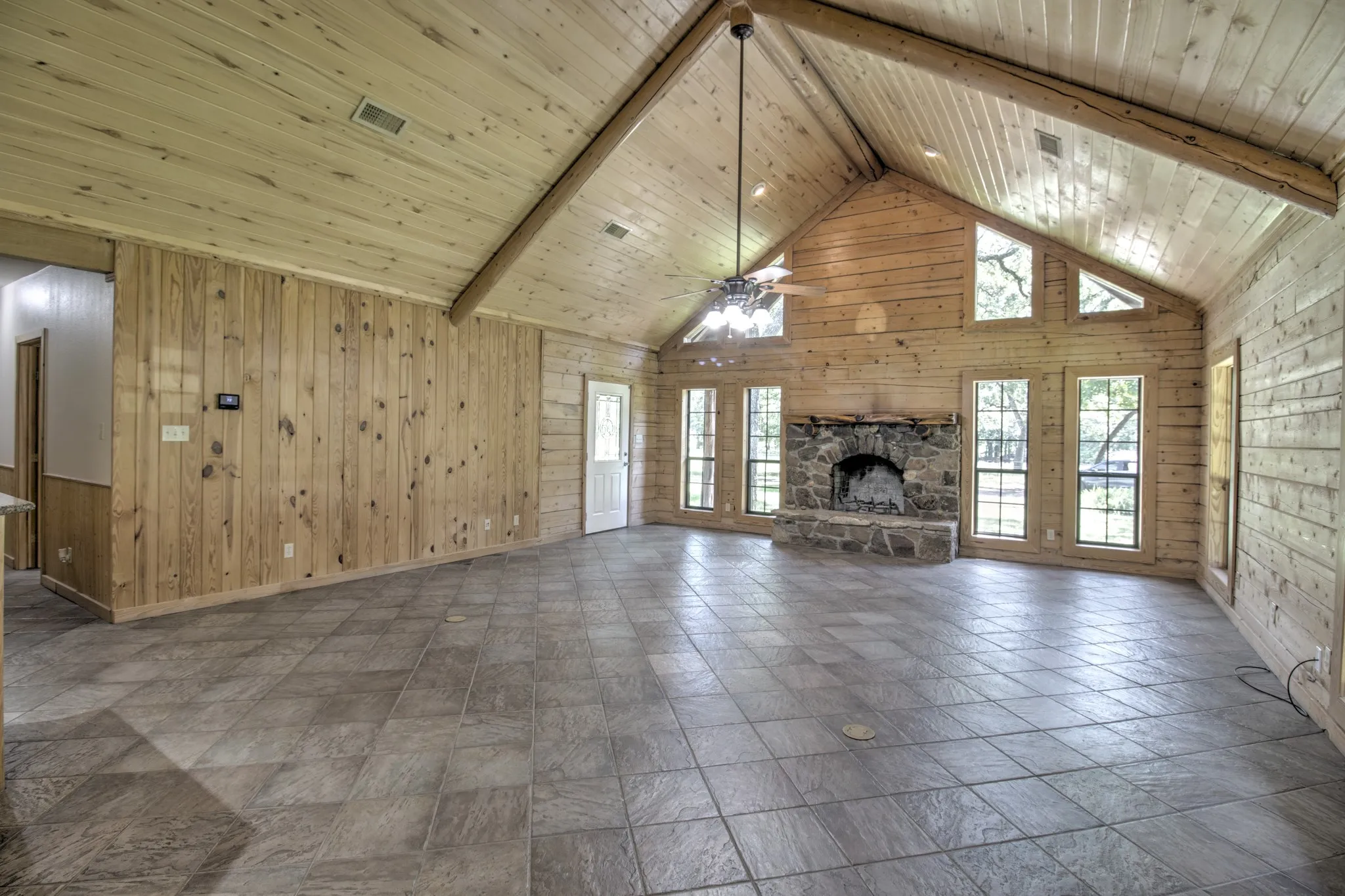 This expansive living room offers a versatile layout ideal for both quiet family relaxation and grand-scale entertaining.