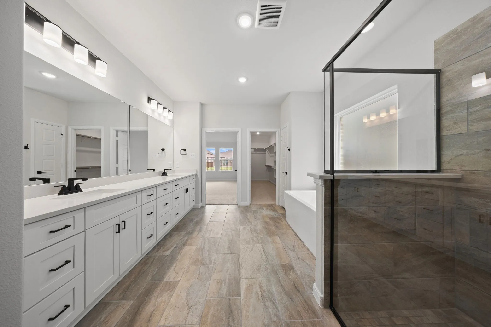 Whether it's soaking your cares away or indulging in a long, luxurious shower, this owner's bath has it all!
