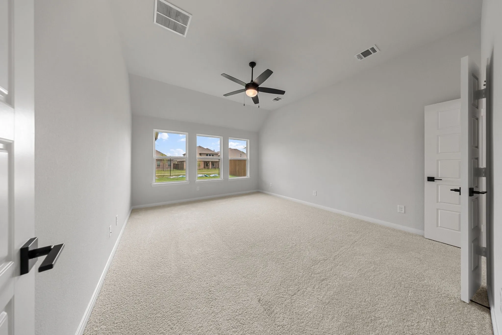 Featuring oversized windows, plush carpeting and a neutral color palette, this owner's suite was designed for rest and relaxation.