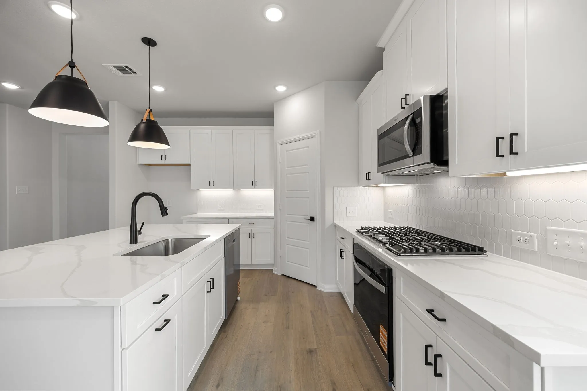 Beautiful cabinetry, lovely backsplash, gorgeous countertops, stainless appliances....what more could you ask for in your dream kitchen?