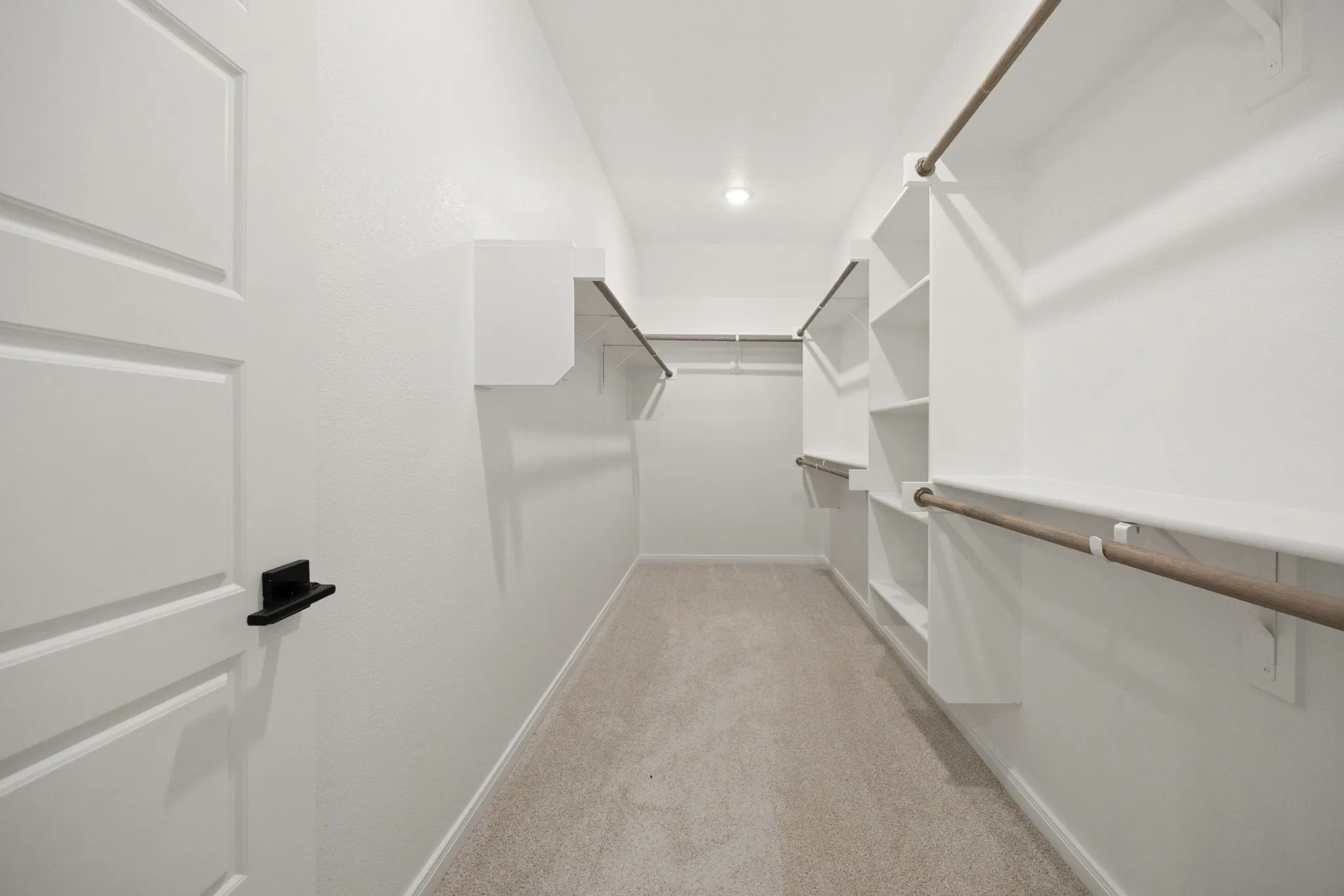 You'll enjoy plenty of hanging and storage space in this dream owner's closet!