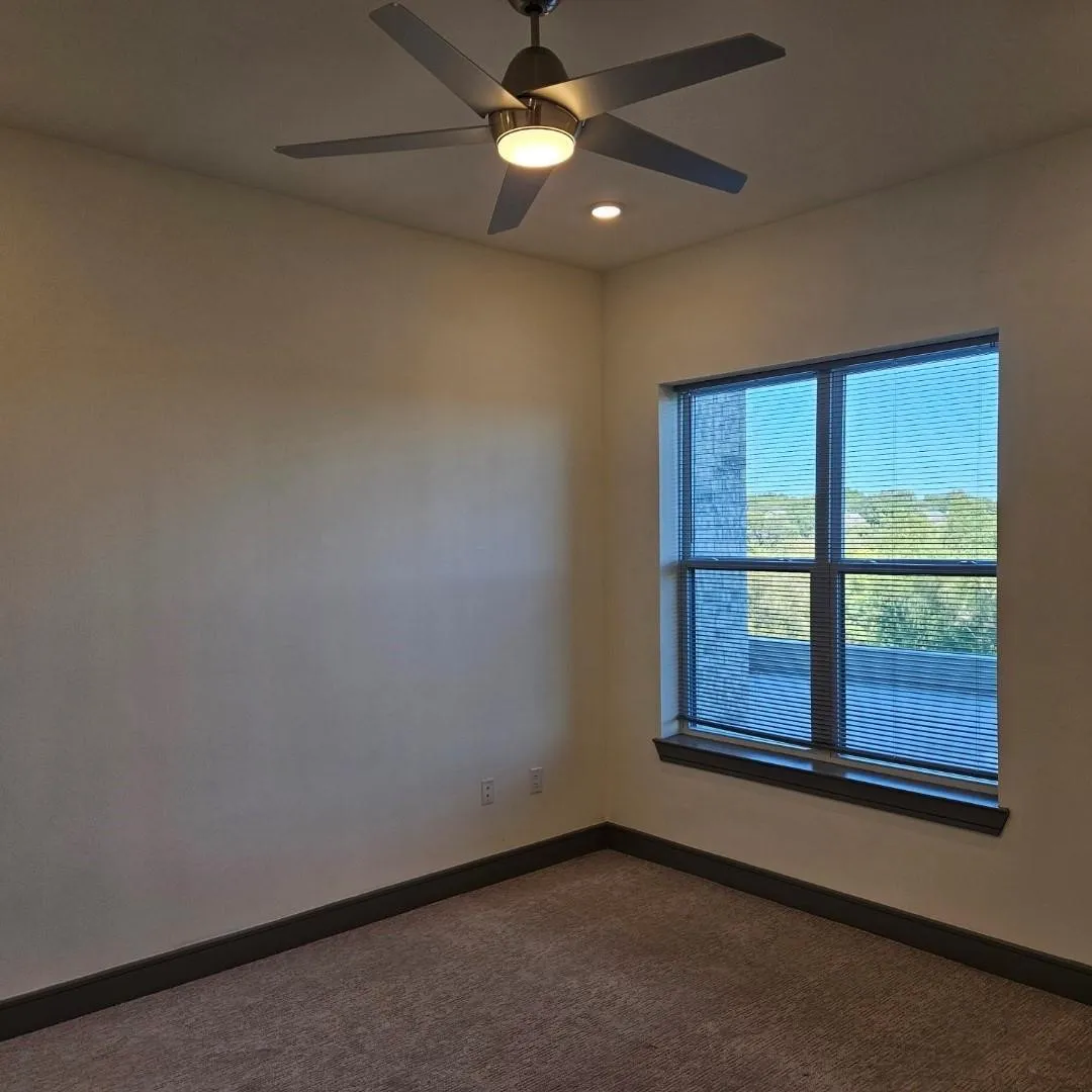 Room featuring a ceiling fan with integrated lighting, recessed ceiling light, and carpet flooring
