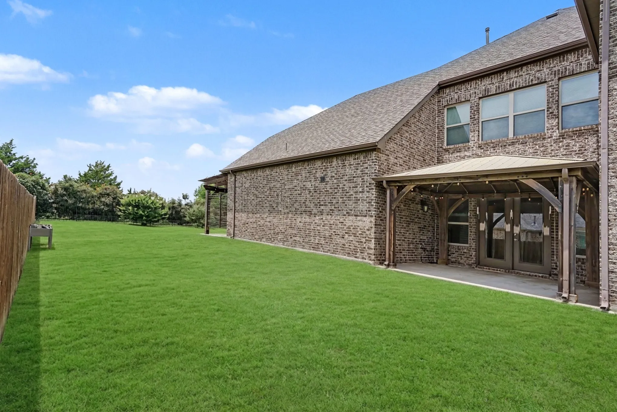 Side of Structure With Covered Patio