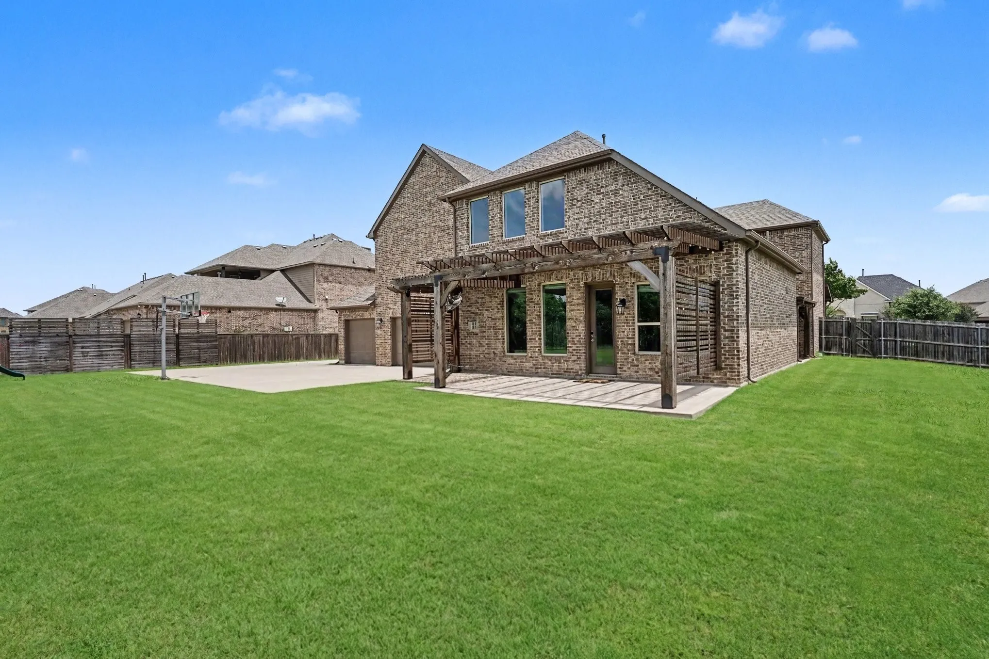 Back of the house with Pergola and Covered Patio