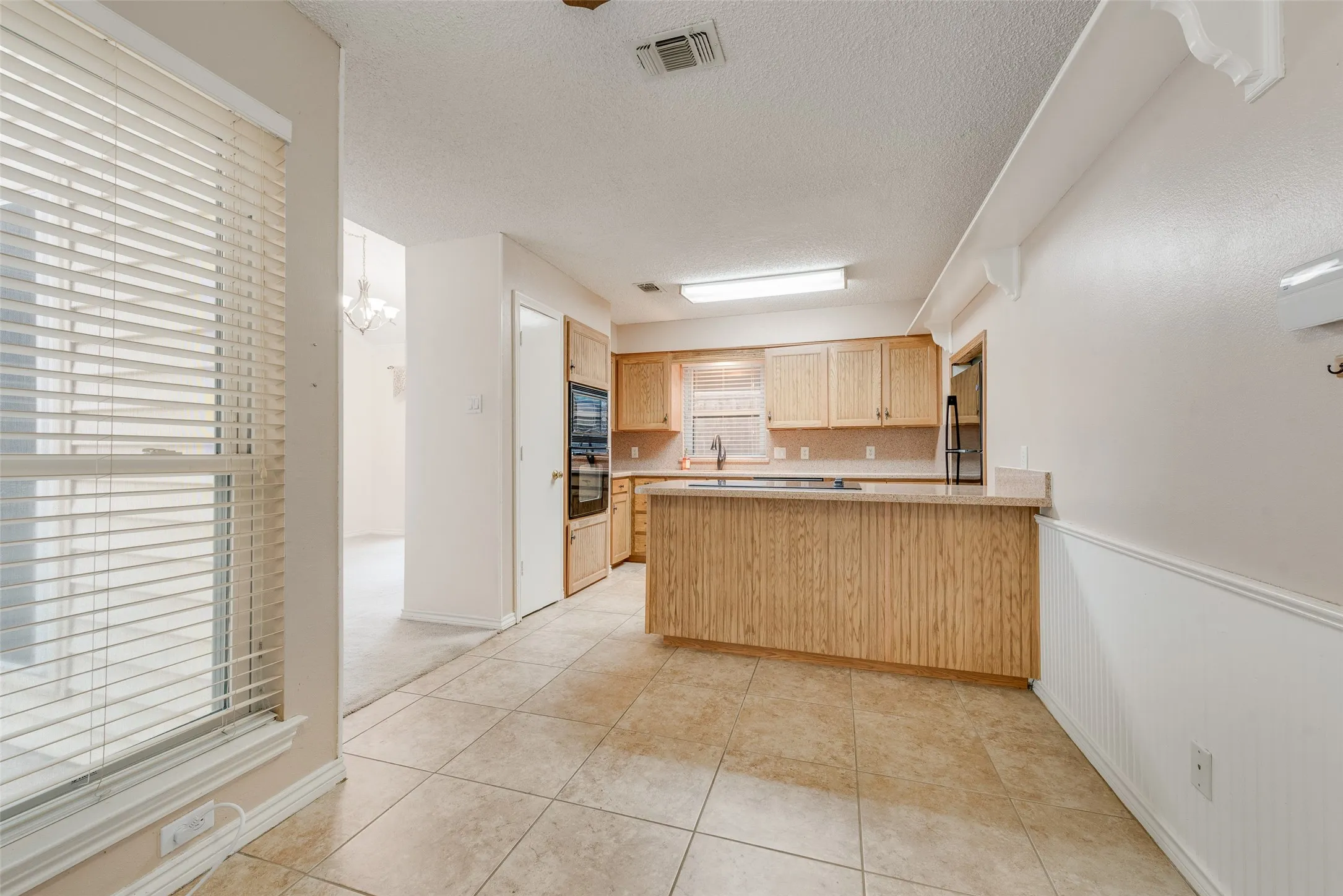 View of kitchen from secondary dining room