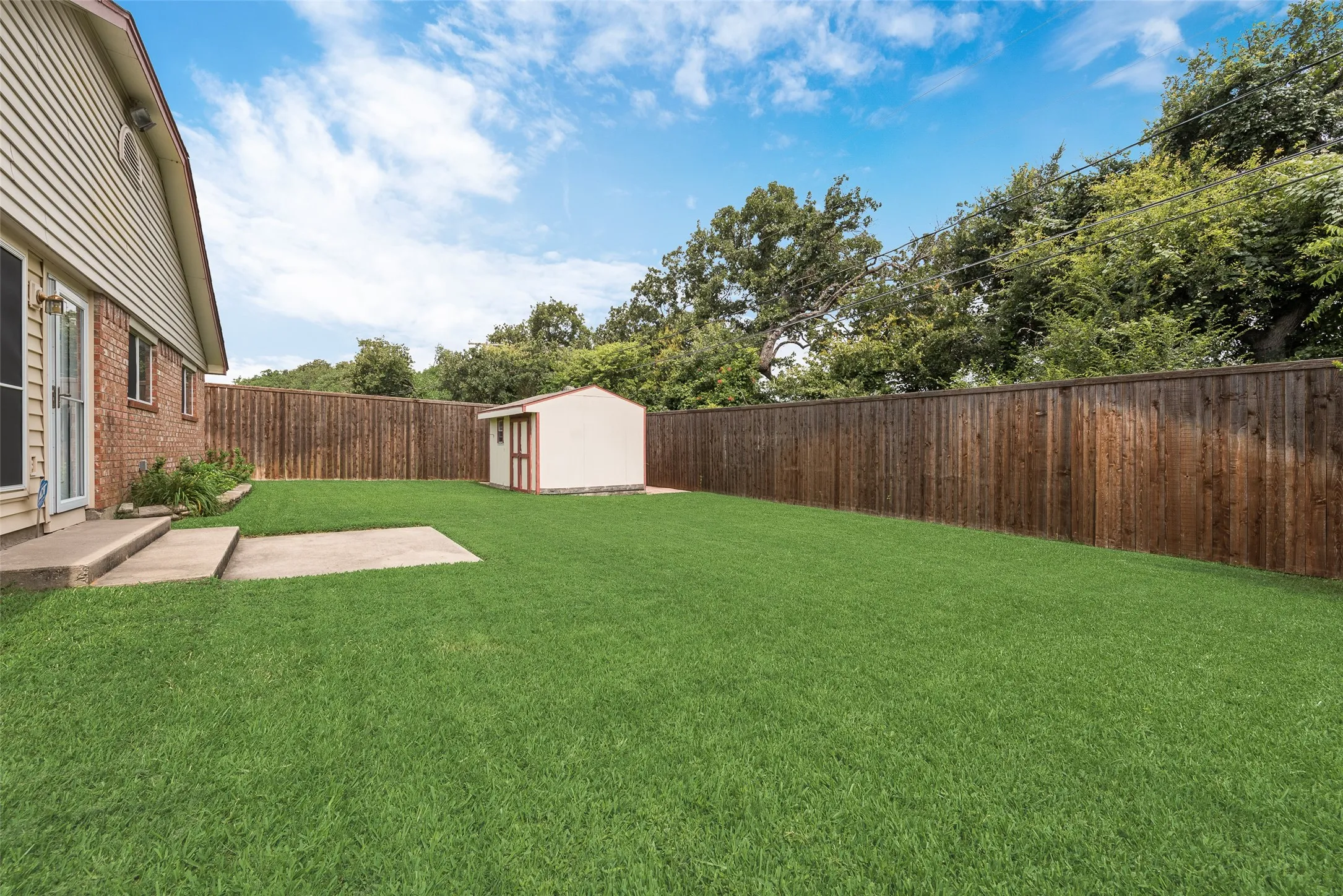 Back yard with view of storage shed