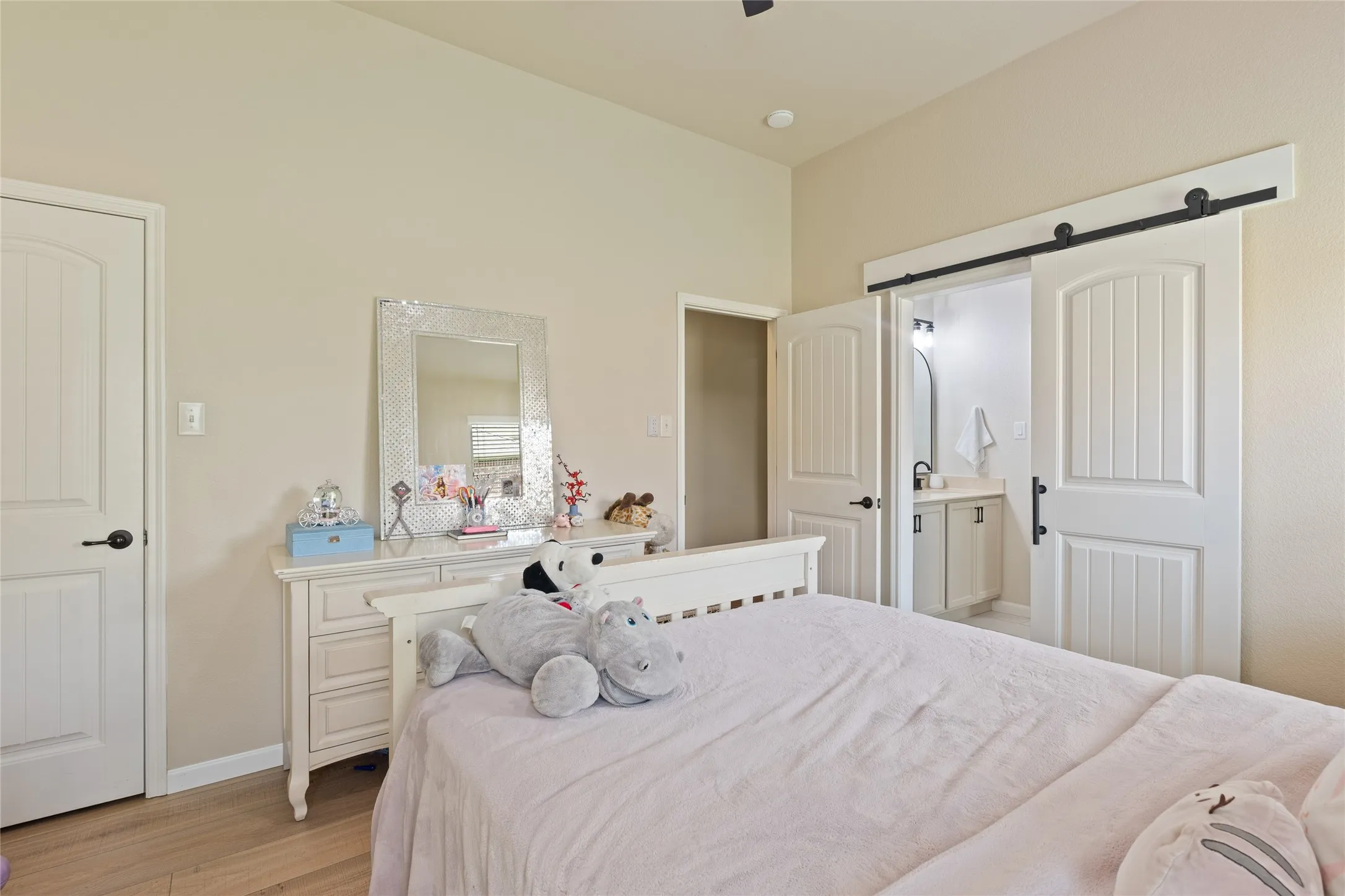Interior room featuring a vaulted ceiling and light wood-finish flooring