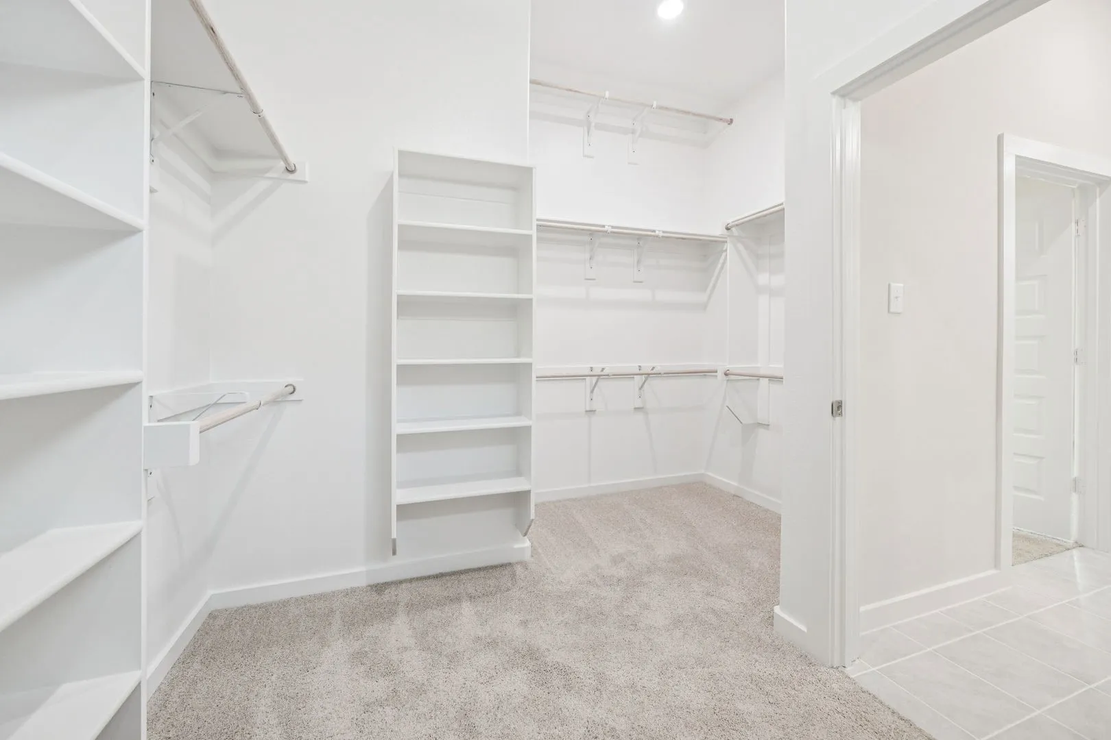 Primary Closet in the Claret home plan by Trophy Signature Homes – REPRESENTATIVE PHOTO