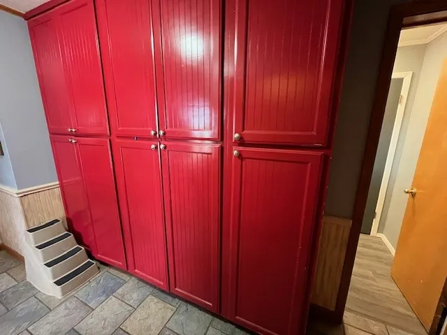 storage cabinets across from laundry closet