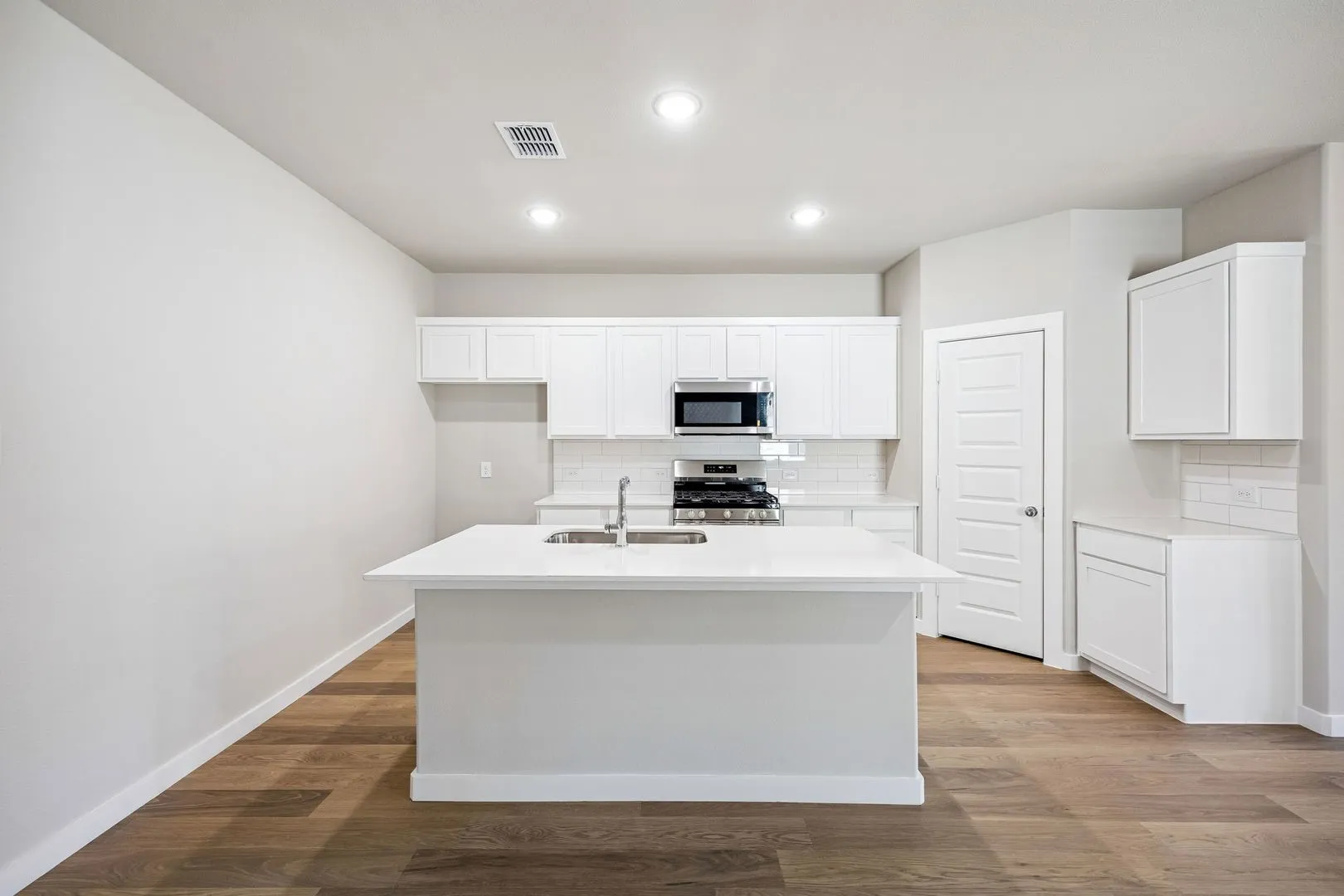 Kitchen in the Willow home plan by Trophy Signature Homes – REPRESENTATIVE PHOTO