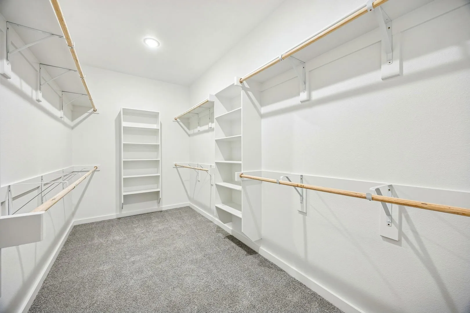 Primary Closet in the Willow home plan by Trophy Signature Homes – REPRESENTATIVE PHOTO