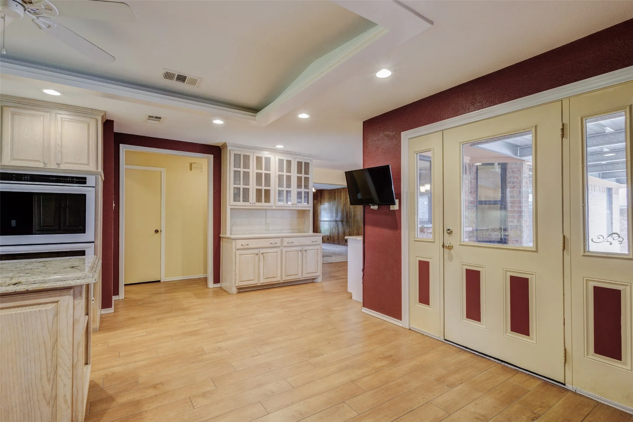 Door from kitchen leading to the carport and large workshop