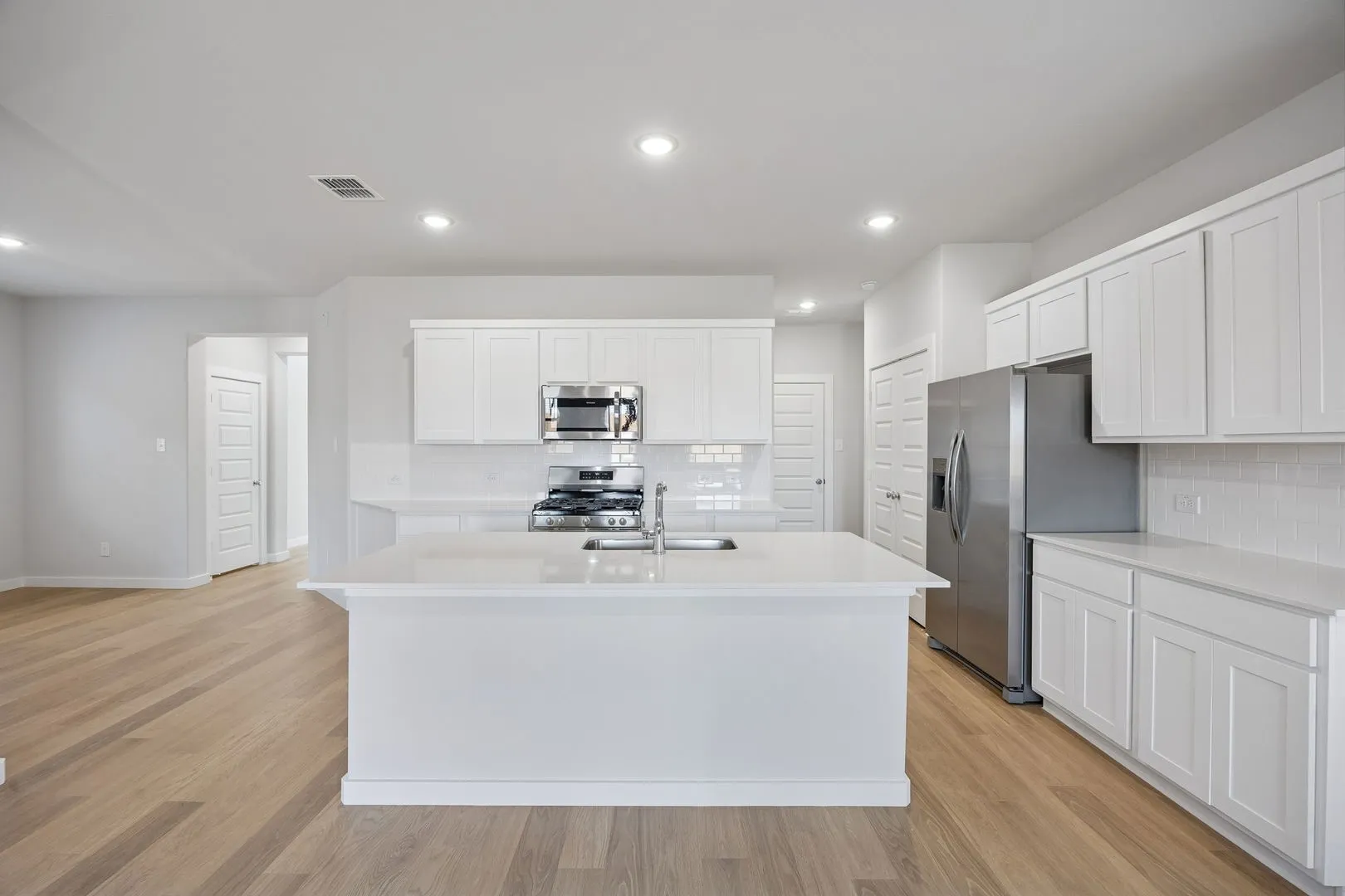 Kitchen in the Oak II home plan by Trophy Signature Homes – REPRESENTATIVE PHOTO