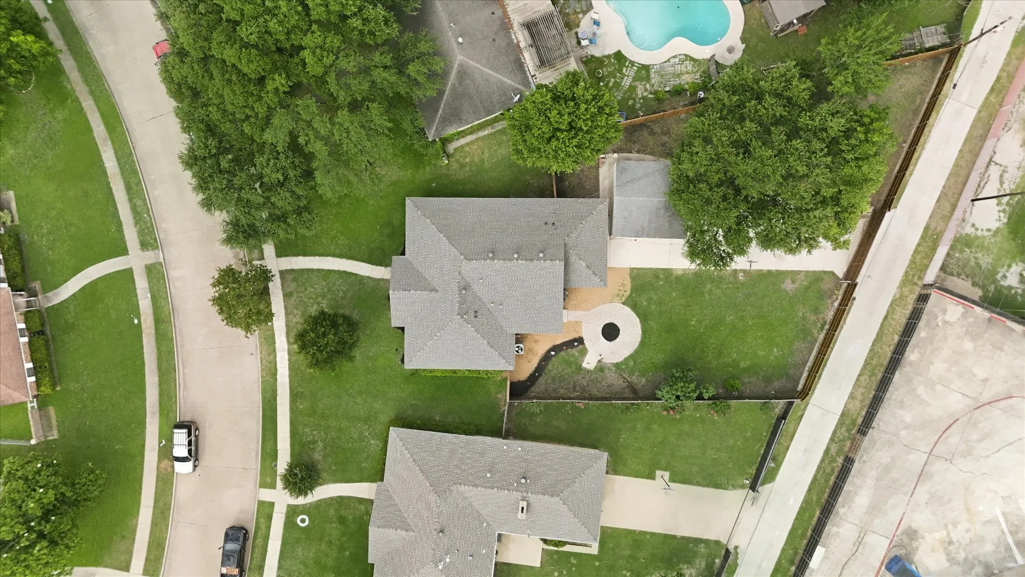 Aerial perspective showcasing a property with a multi-gabled roofline