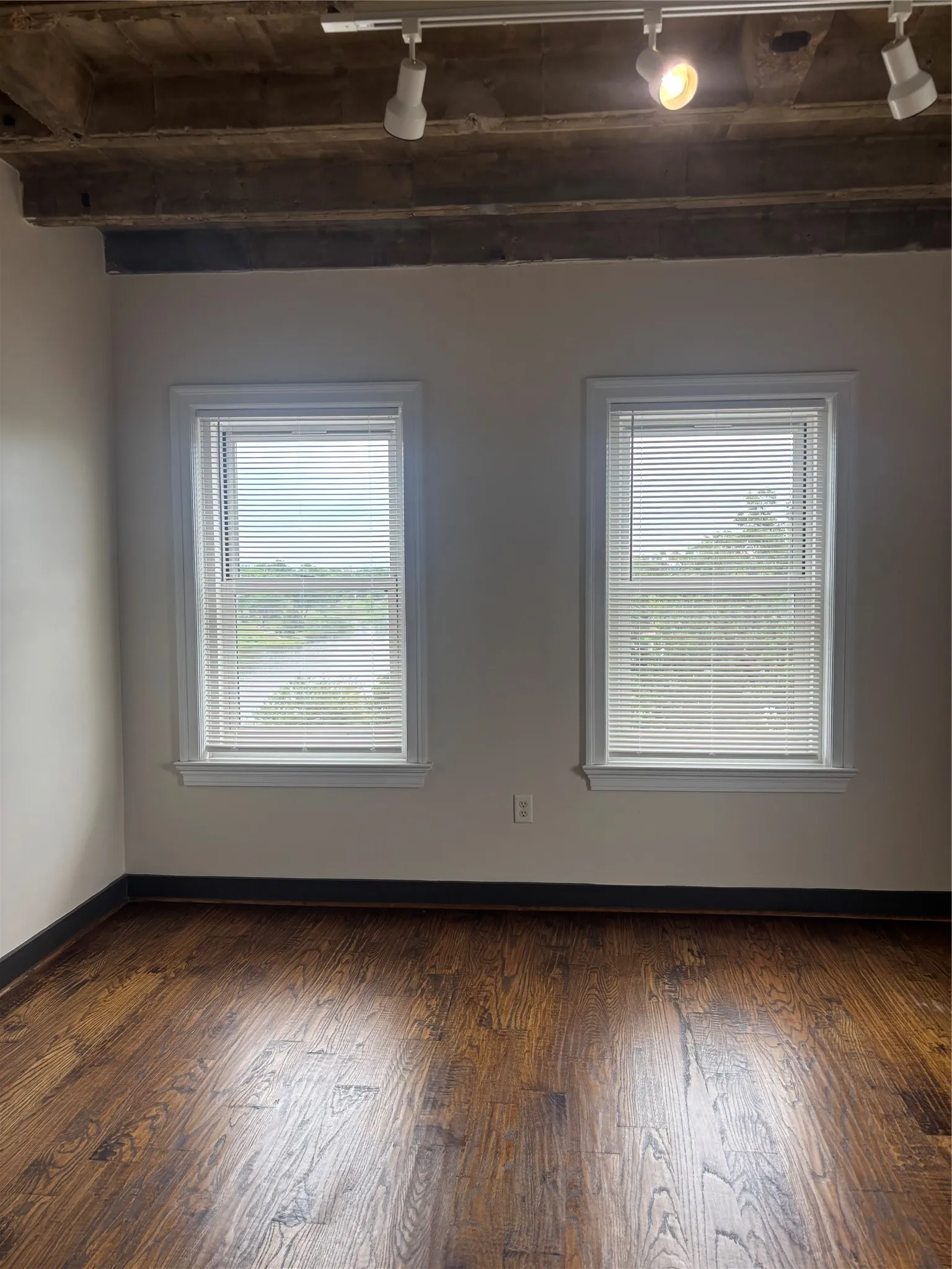 Hardwood-style flooring complemented by light neutral walls