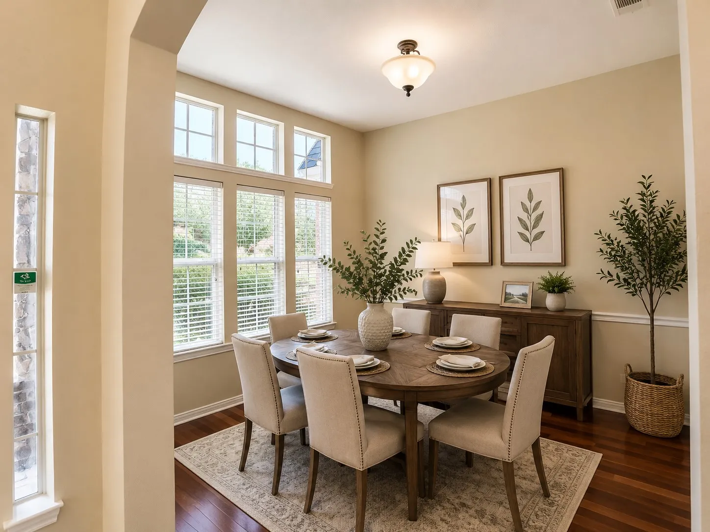 Formal dining area featuring rich wood-finish flooring