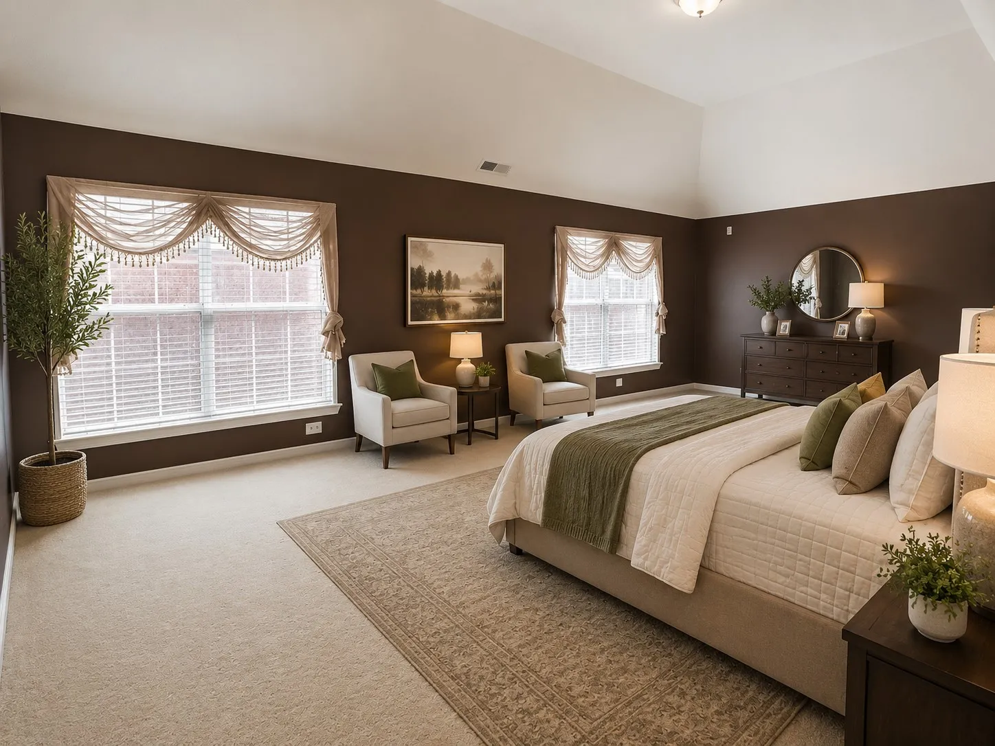 Spacious room featuring vaulted ceilings, plush carpeting, twin windows with blinds, and a built-in dresser