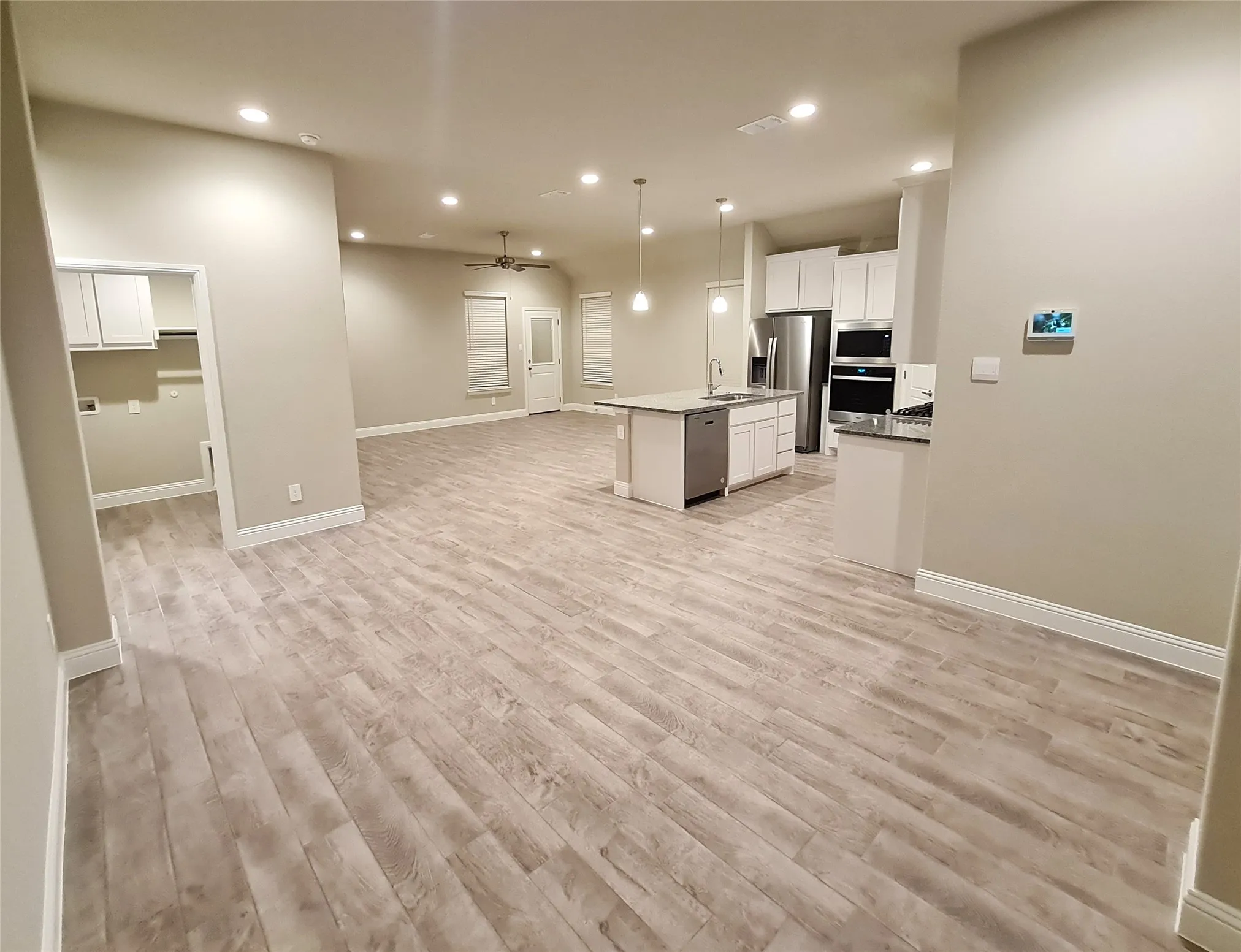 View from Dining area towards kitchen and living area.