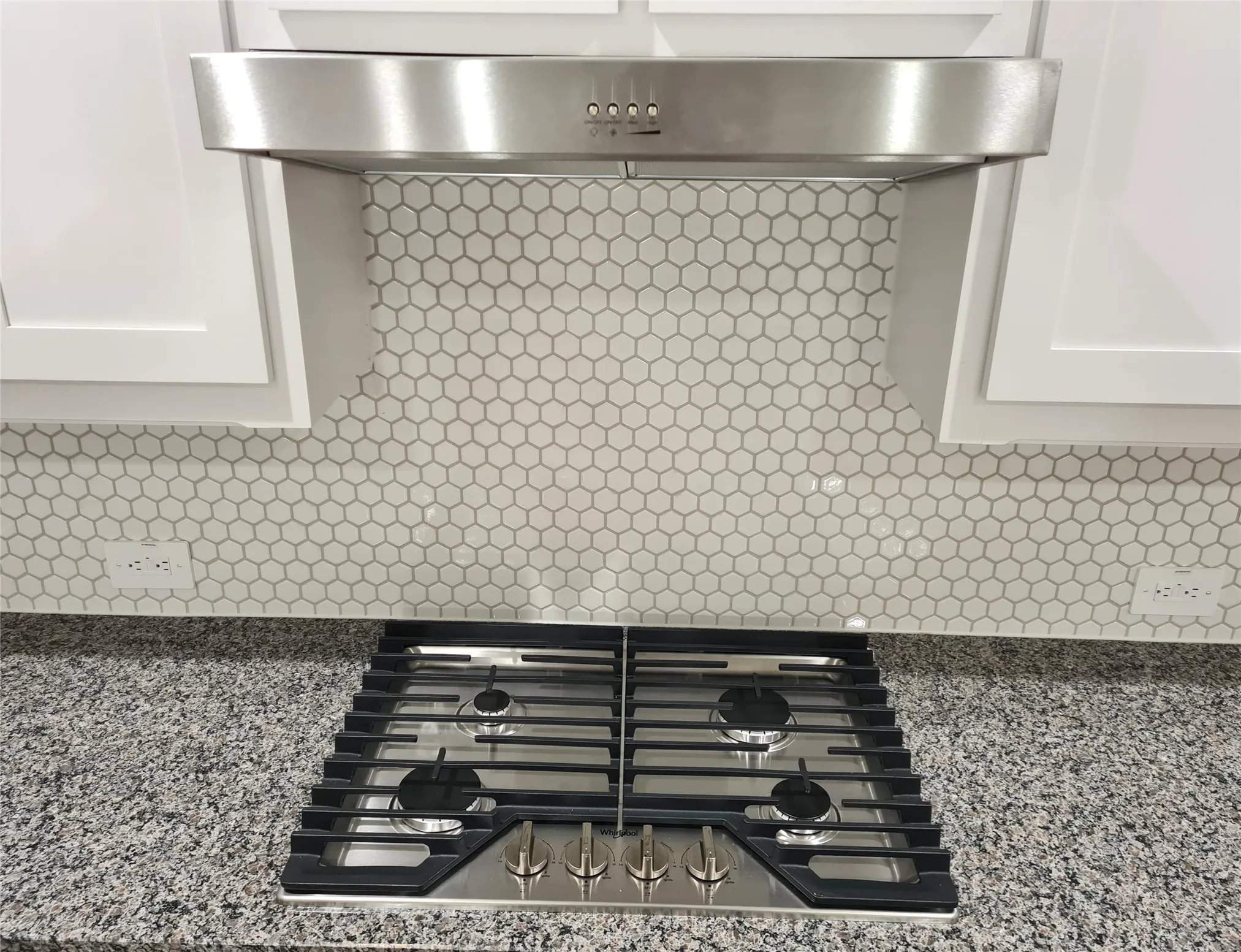 Stainless Steel Gas Cooktop and Vent-hood with Ducted Exhaust to Outside.