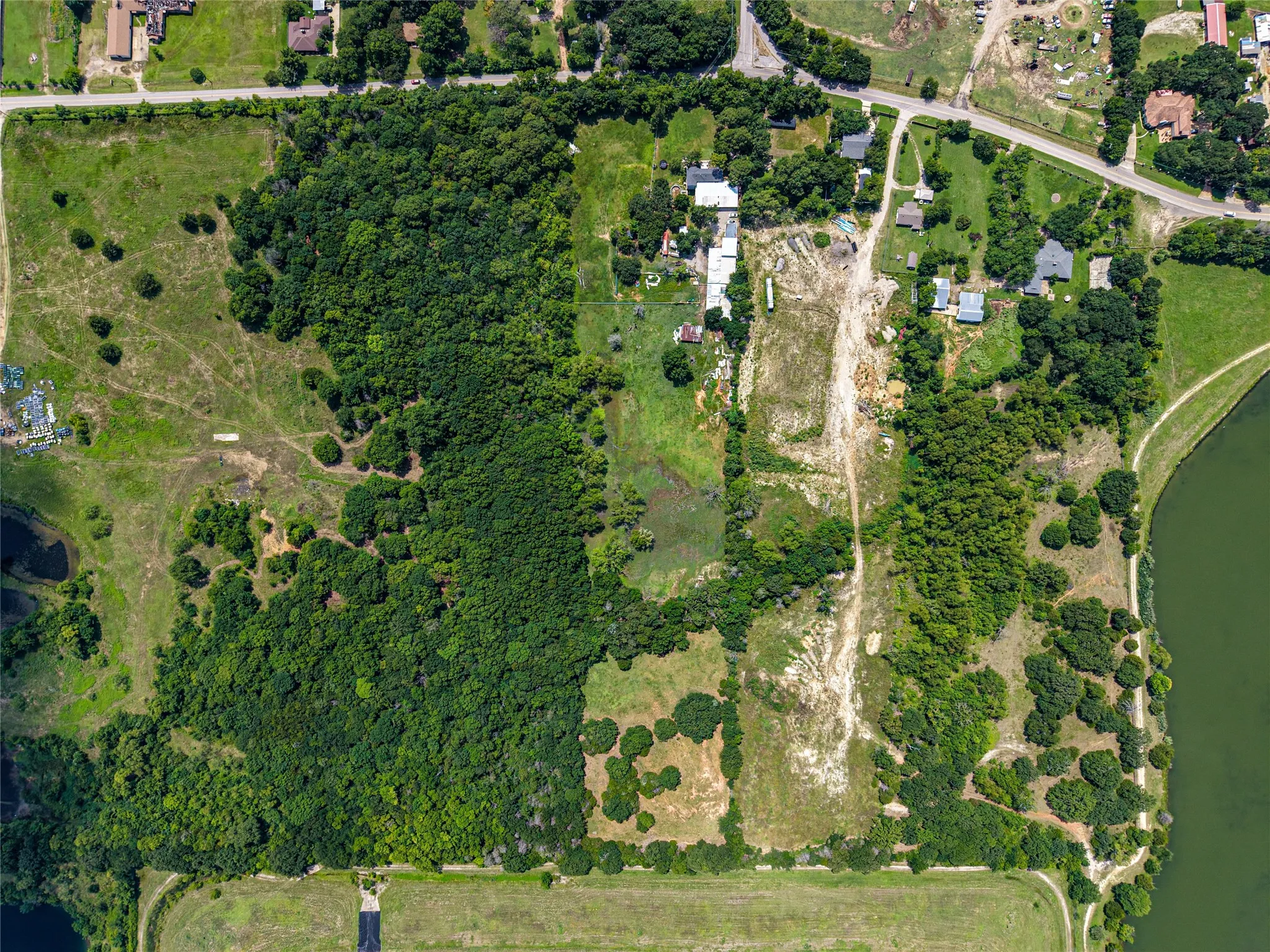 Expansive property featuring significant wooded areas and cleared land