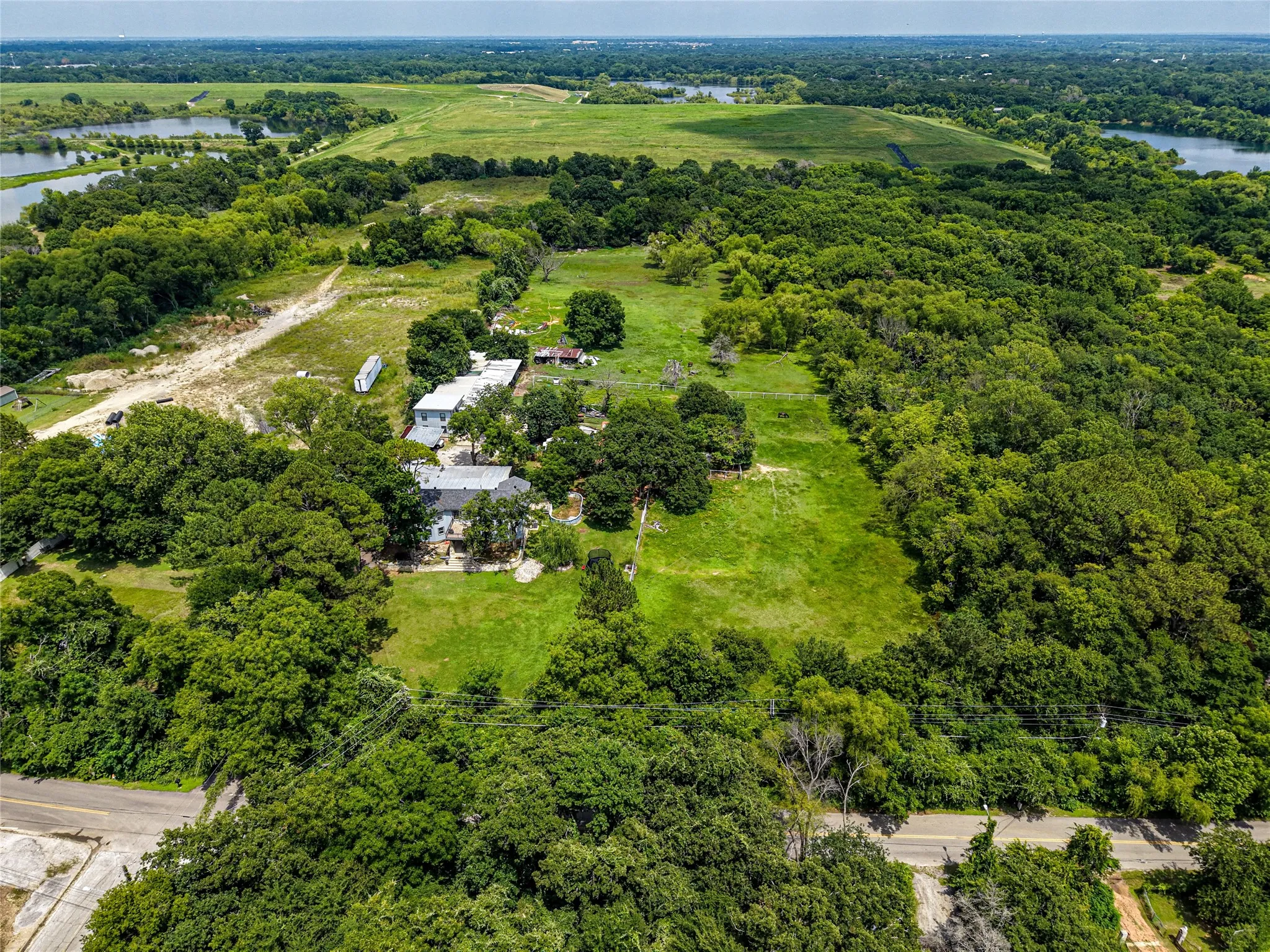 Expansive property featuring lush green spaces and mature trees