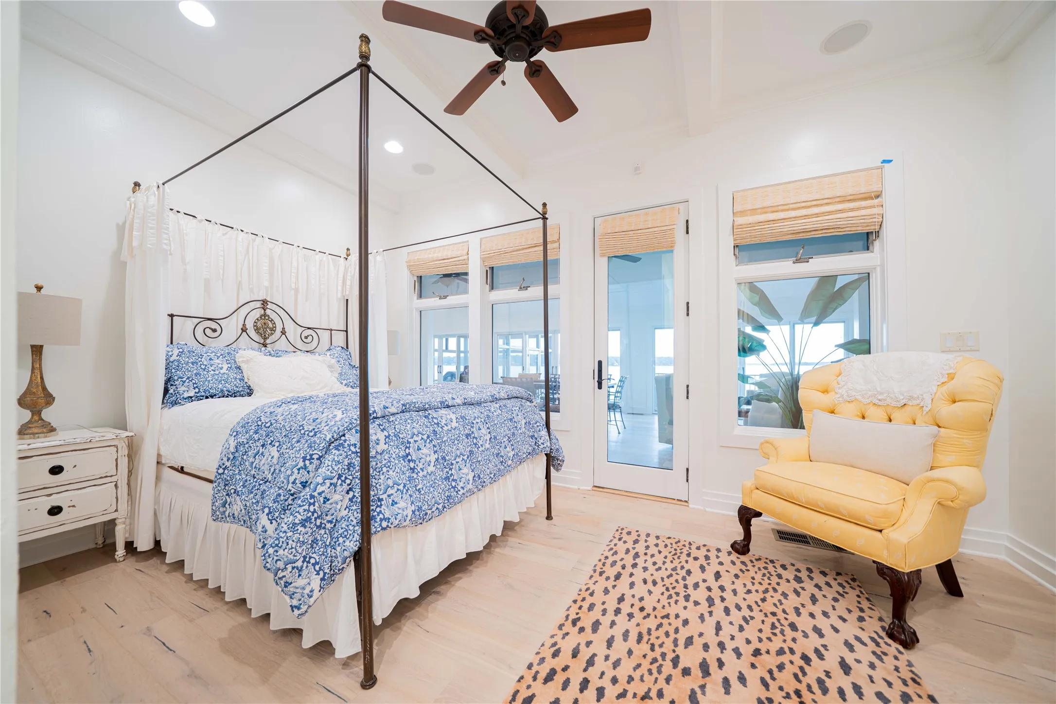 Bedroom with access to exterior, light wood finished floors, ornamental molding, recessed lighting, and beamed ceiling