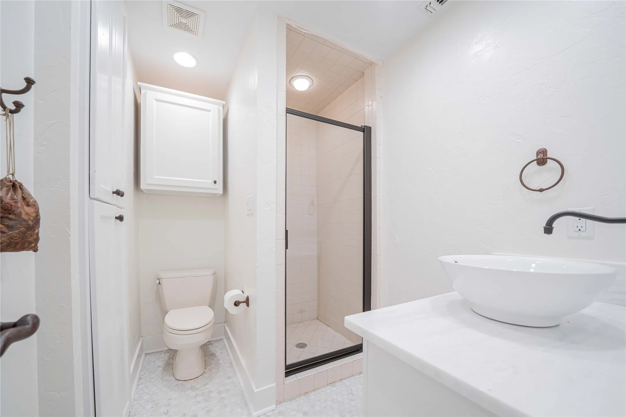 Full bathroom featuring a shower stall and vanity
