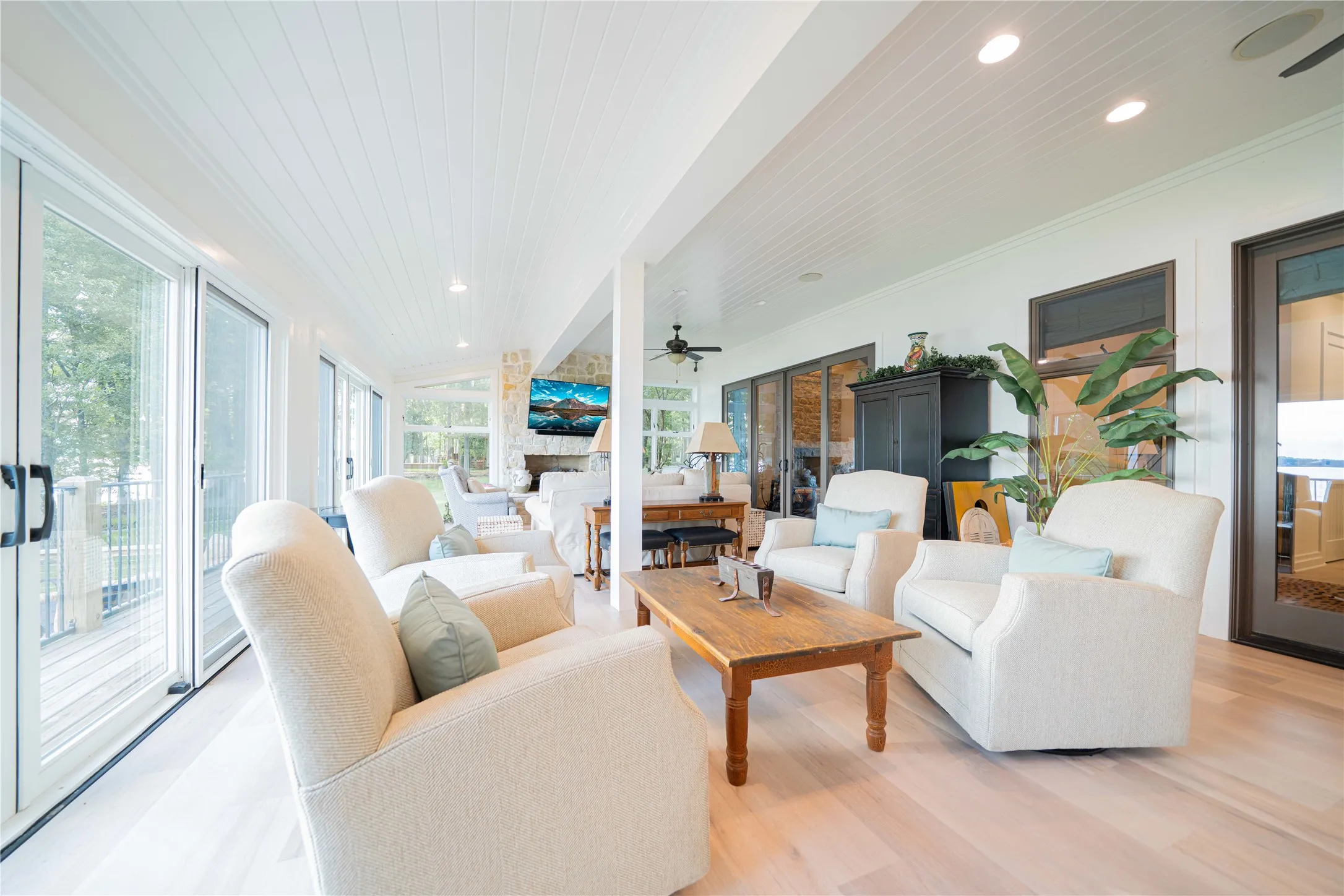 Living room featuring recessed lighting, crown molding, light wood-type flooring, and a ceiling fan