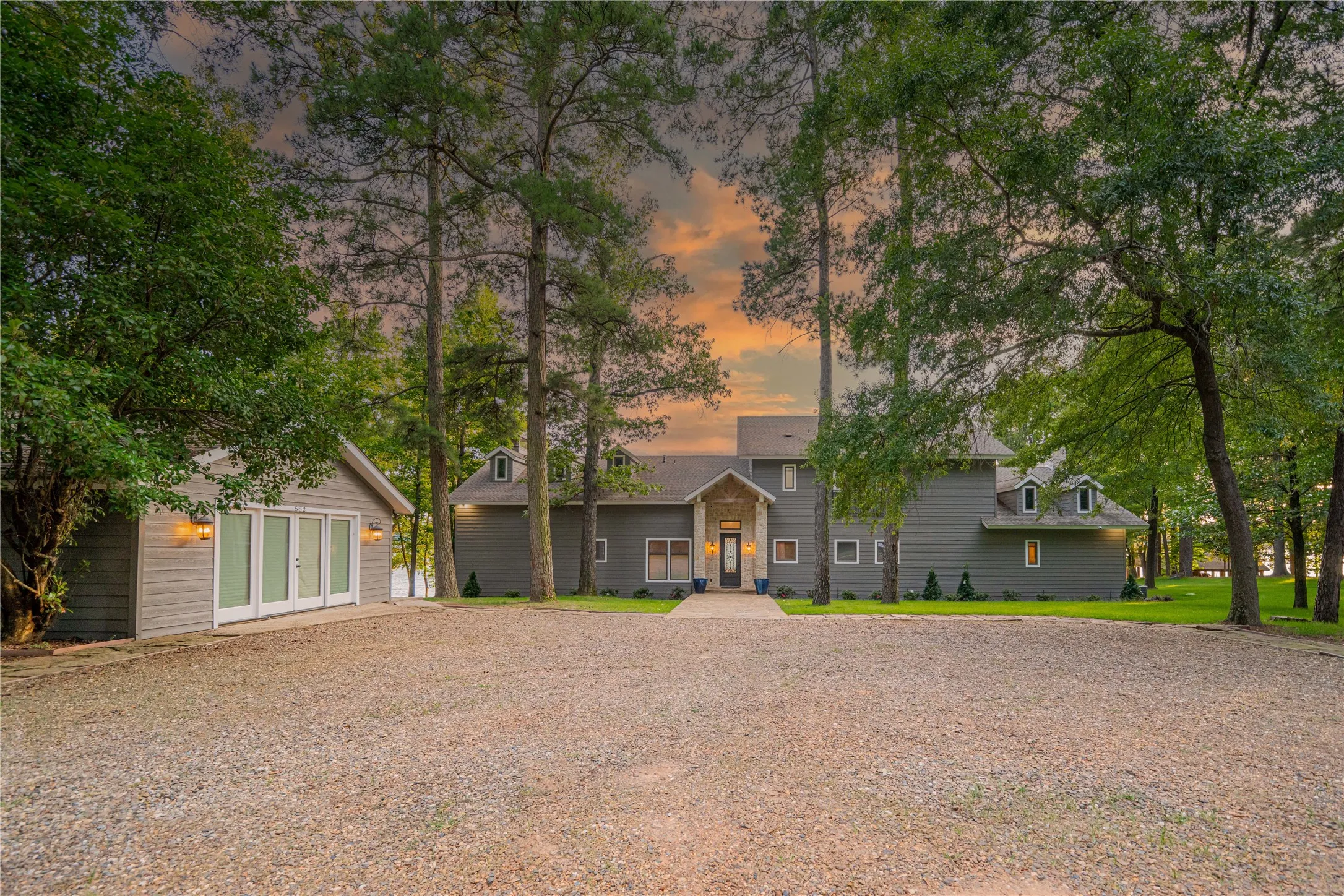 View of front of house with an outdoor structure and french doors