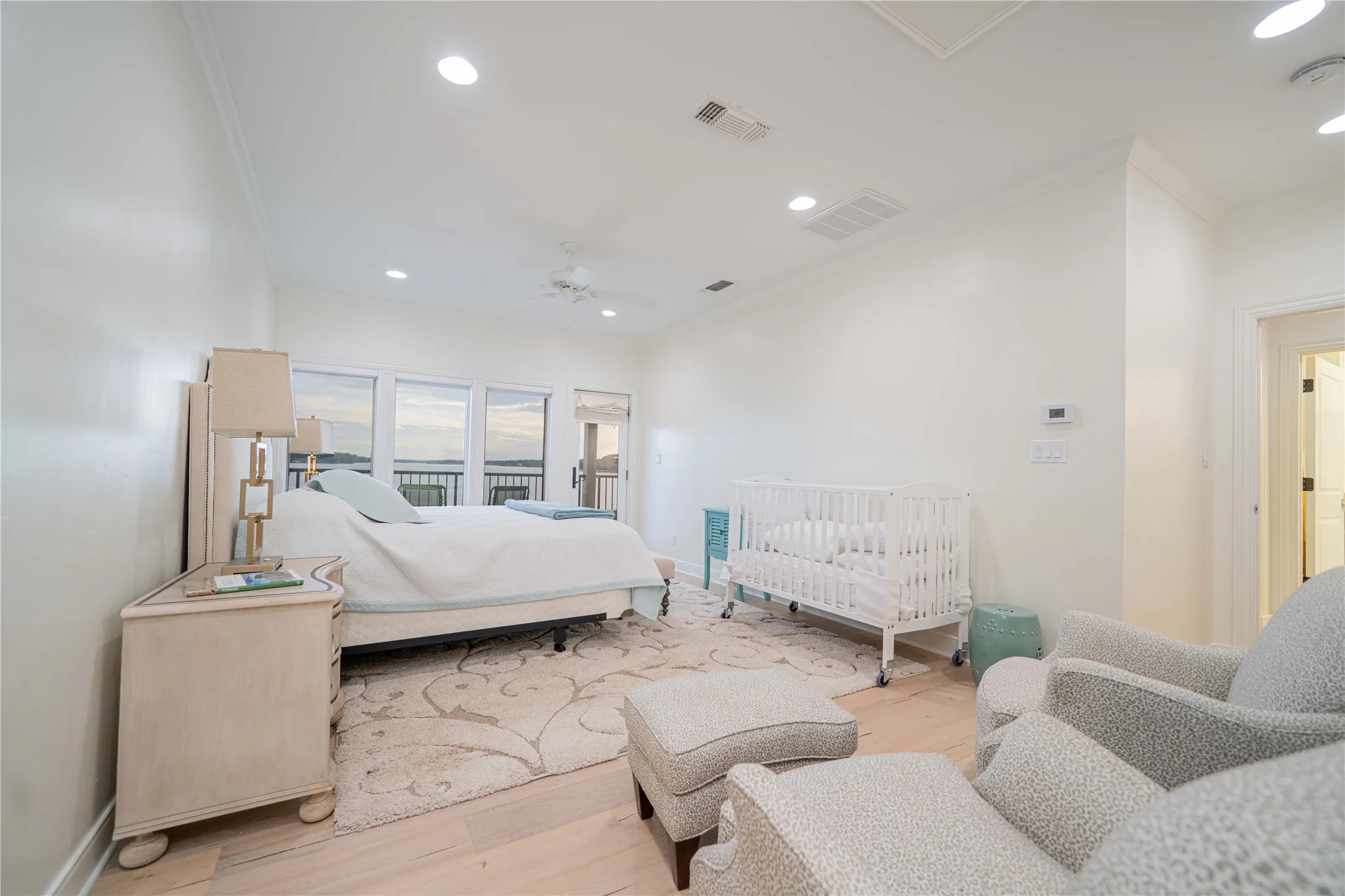 Bedroom with crown molding, wood finished floors, recessed lighting, and a ceiling fan