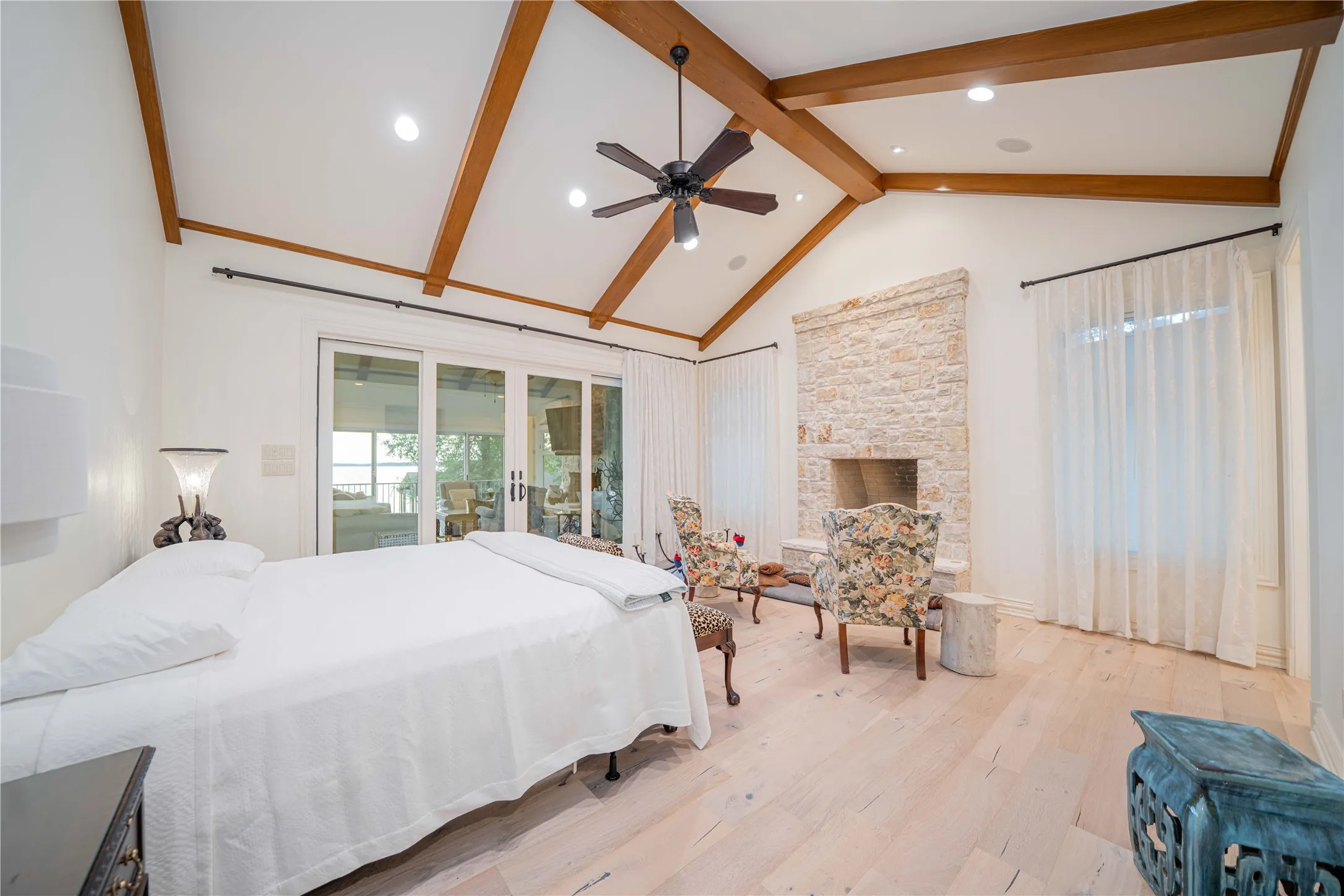 Bedroom featuring french doors, beamed ceiling, wood finished floors, high vaulted ceiling, and recessed lighting