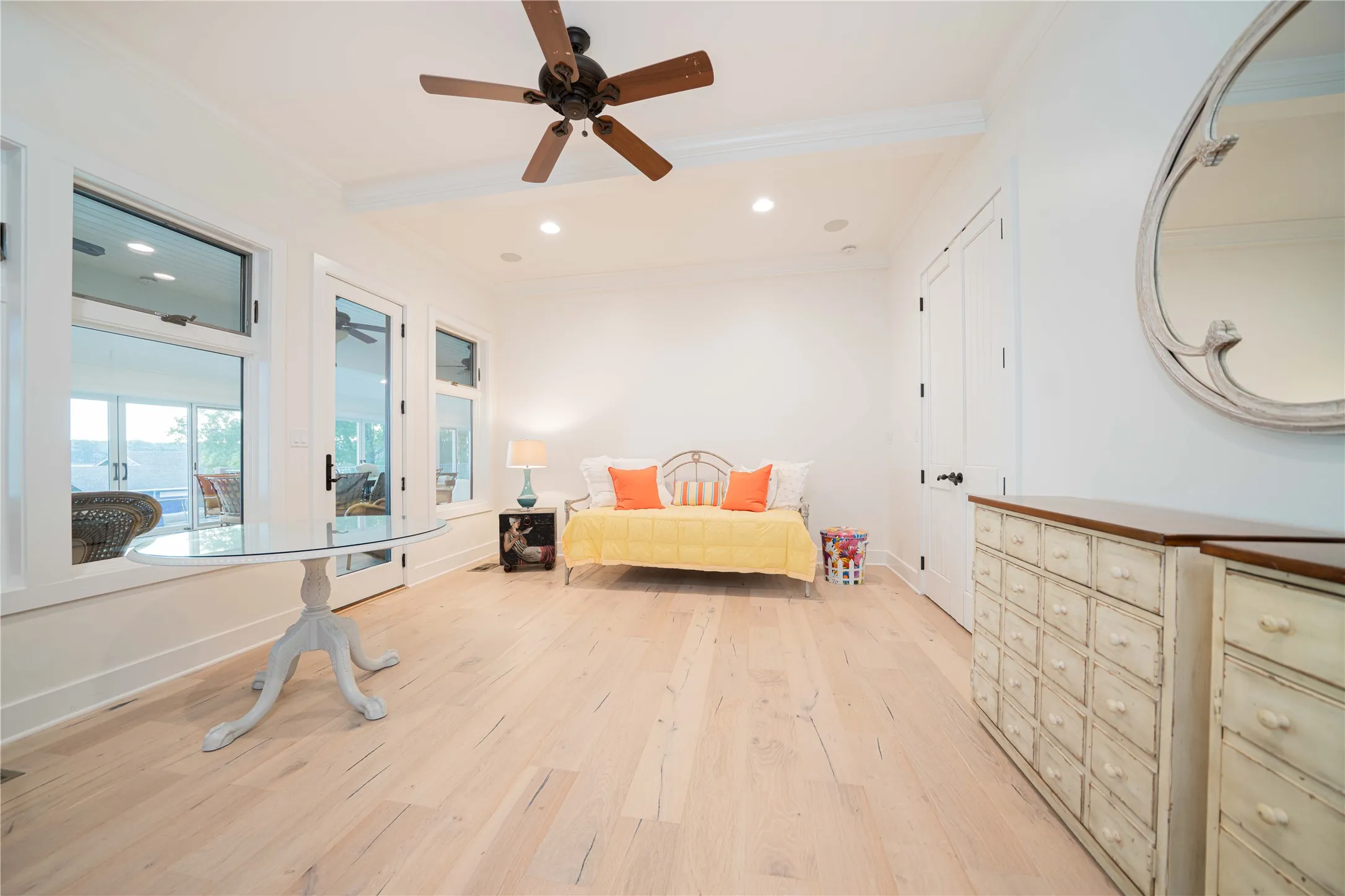 Bedroom with crown molding, light wood-style flooring, recessed lighting, and ceiling fan