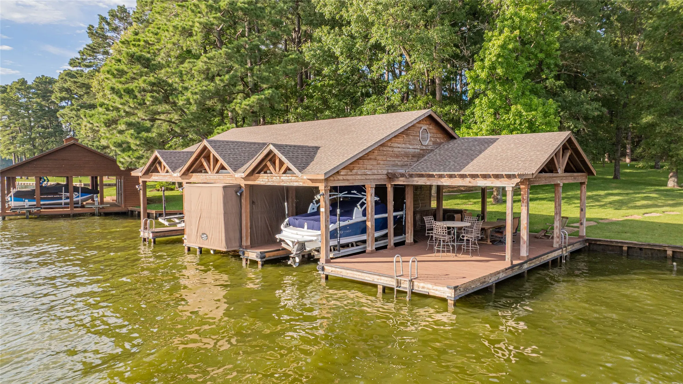 Dock featuring boat lift and a water view