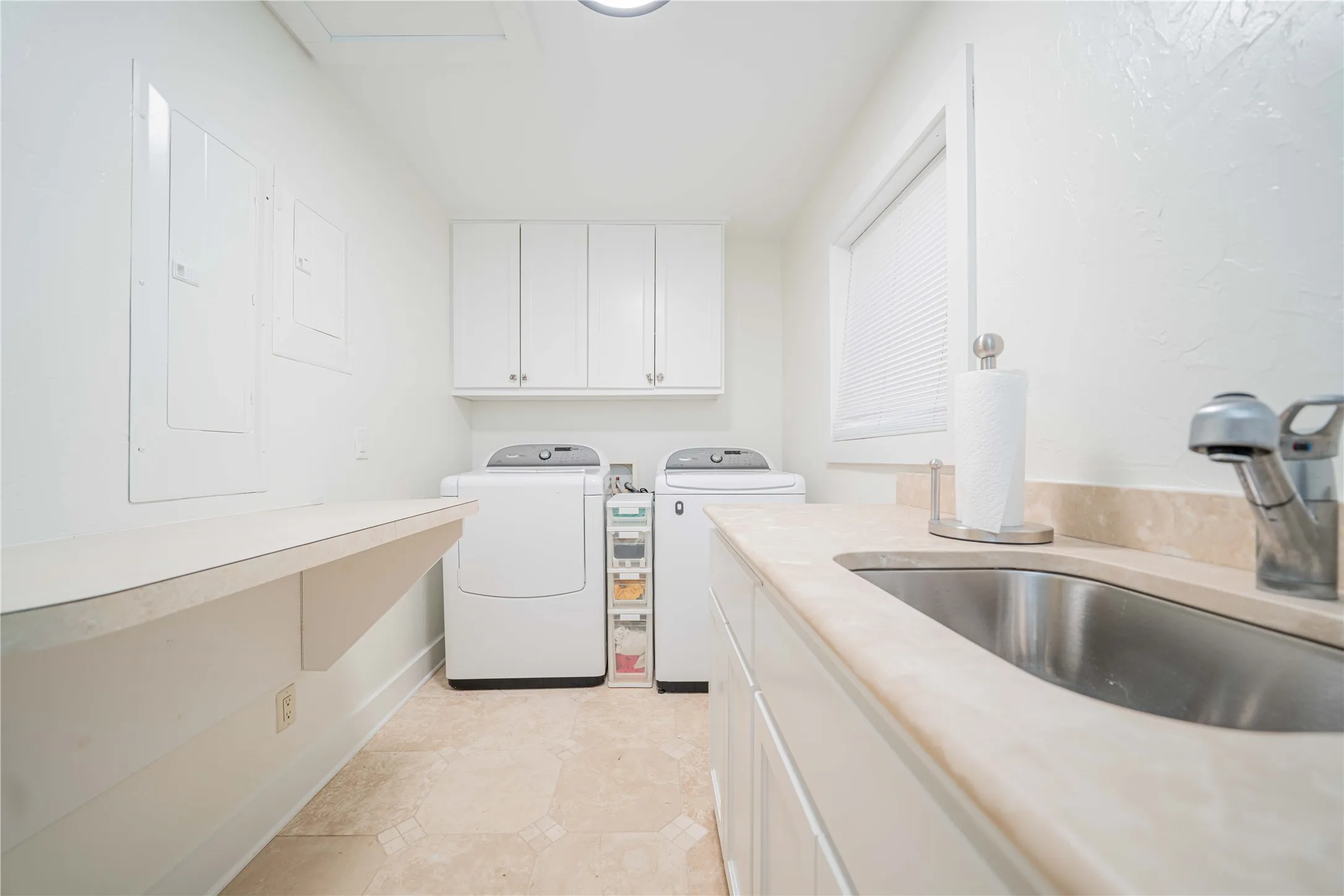 Laundry area featuring cabinet space and washer and dryer