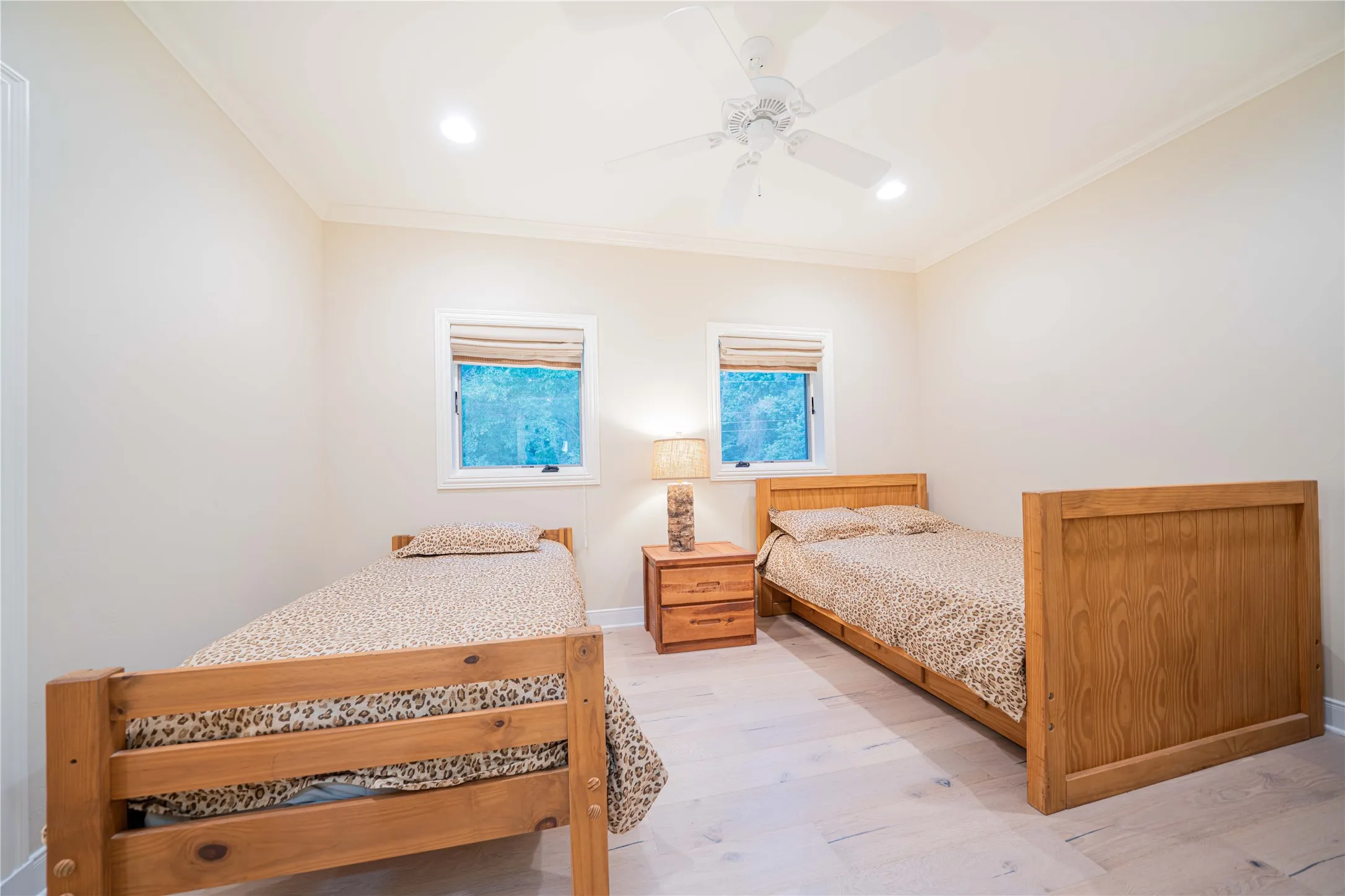 Bedroom featuring ornamental molding, light wood-type flooring, recessed lighting, and a ceiling fan